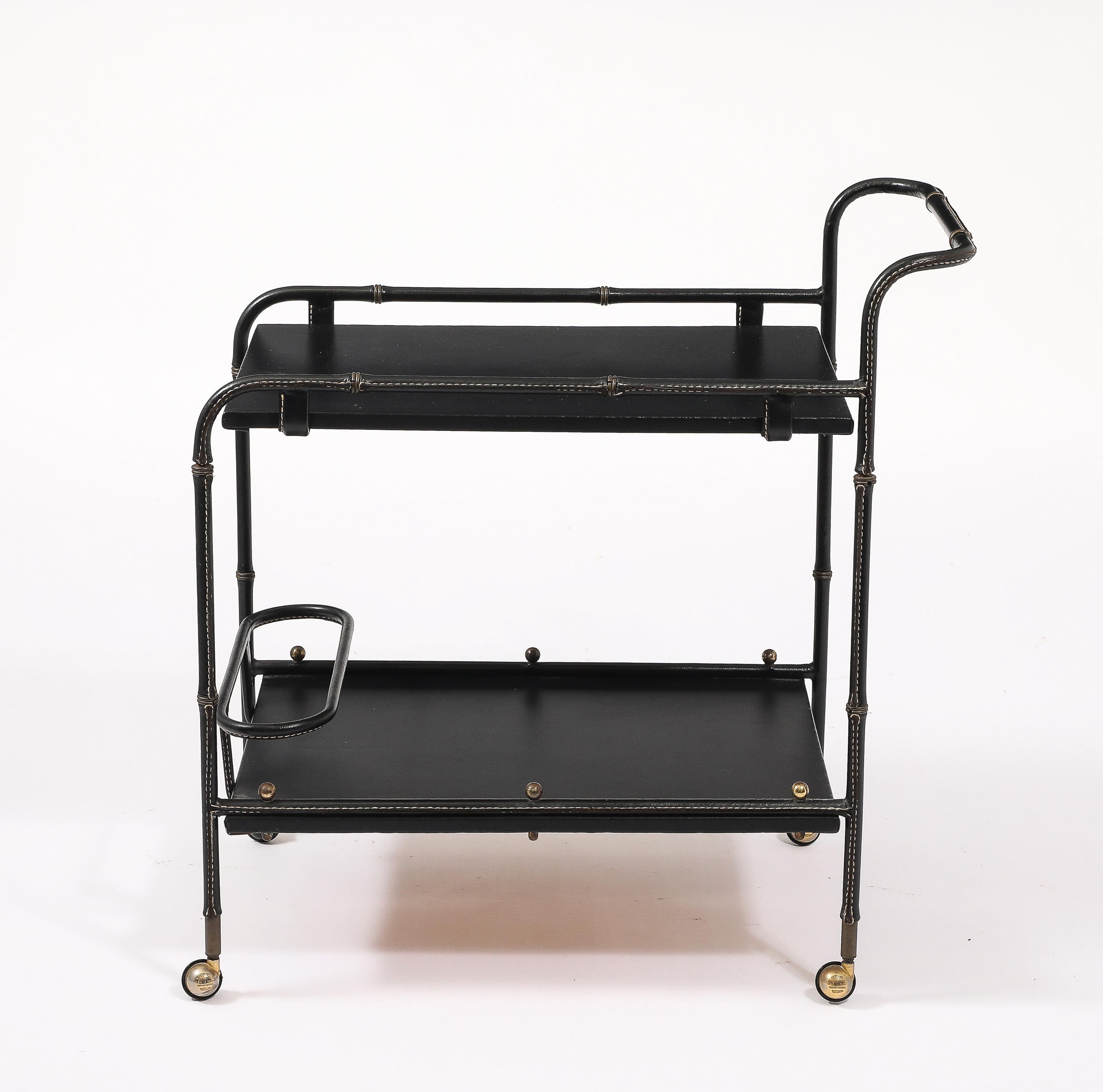 Absolutely perfect bar cart with faux bamboo details, great proportions in original leather, amazing condition.

3x18x31
Levels 8 & 24