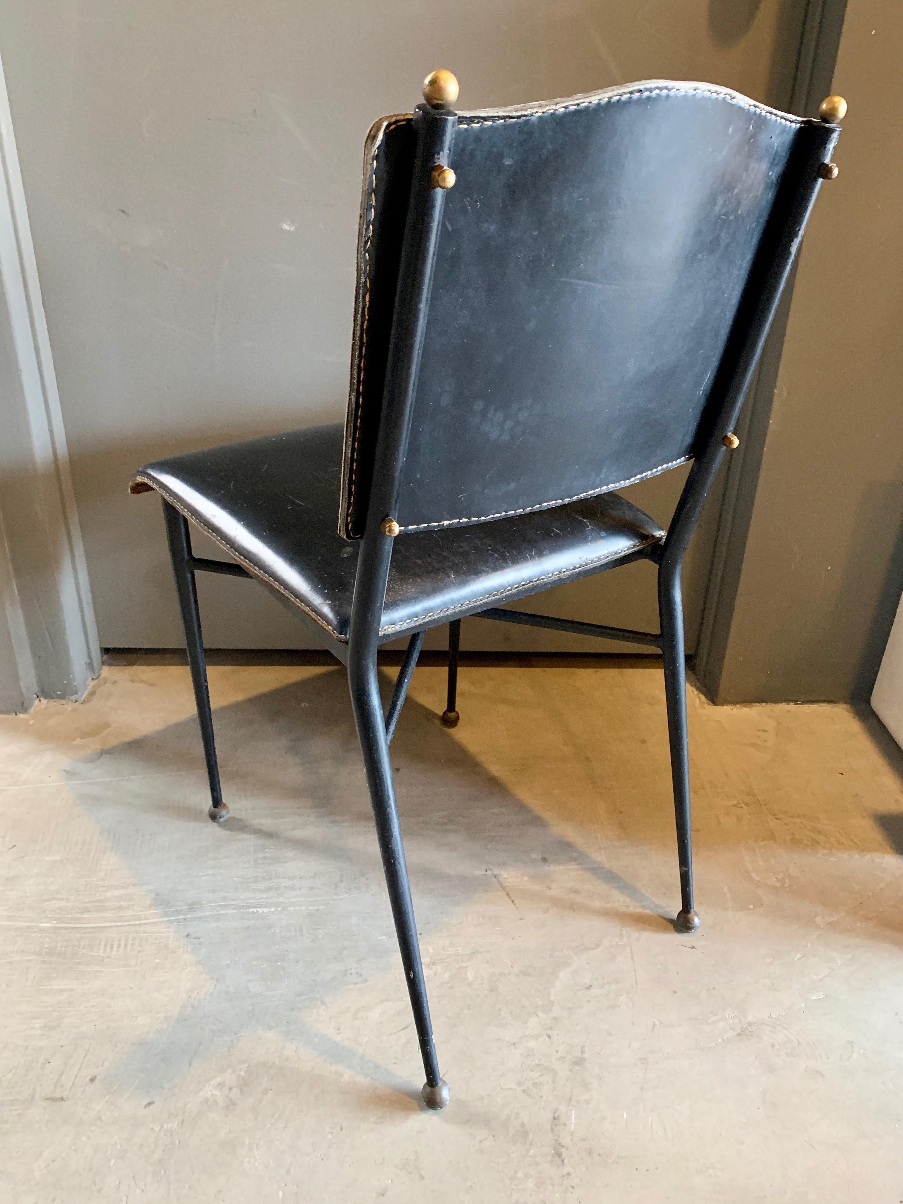 Stunning chair French designer Jacques Adnet. Iron frame with black leather seat and seat back. In good original condition. Signature Adnet contrast stitching. Gorgeous standalone chair.


Over 75 pieces of Jacques Adnet in our other