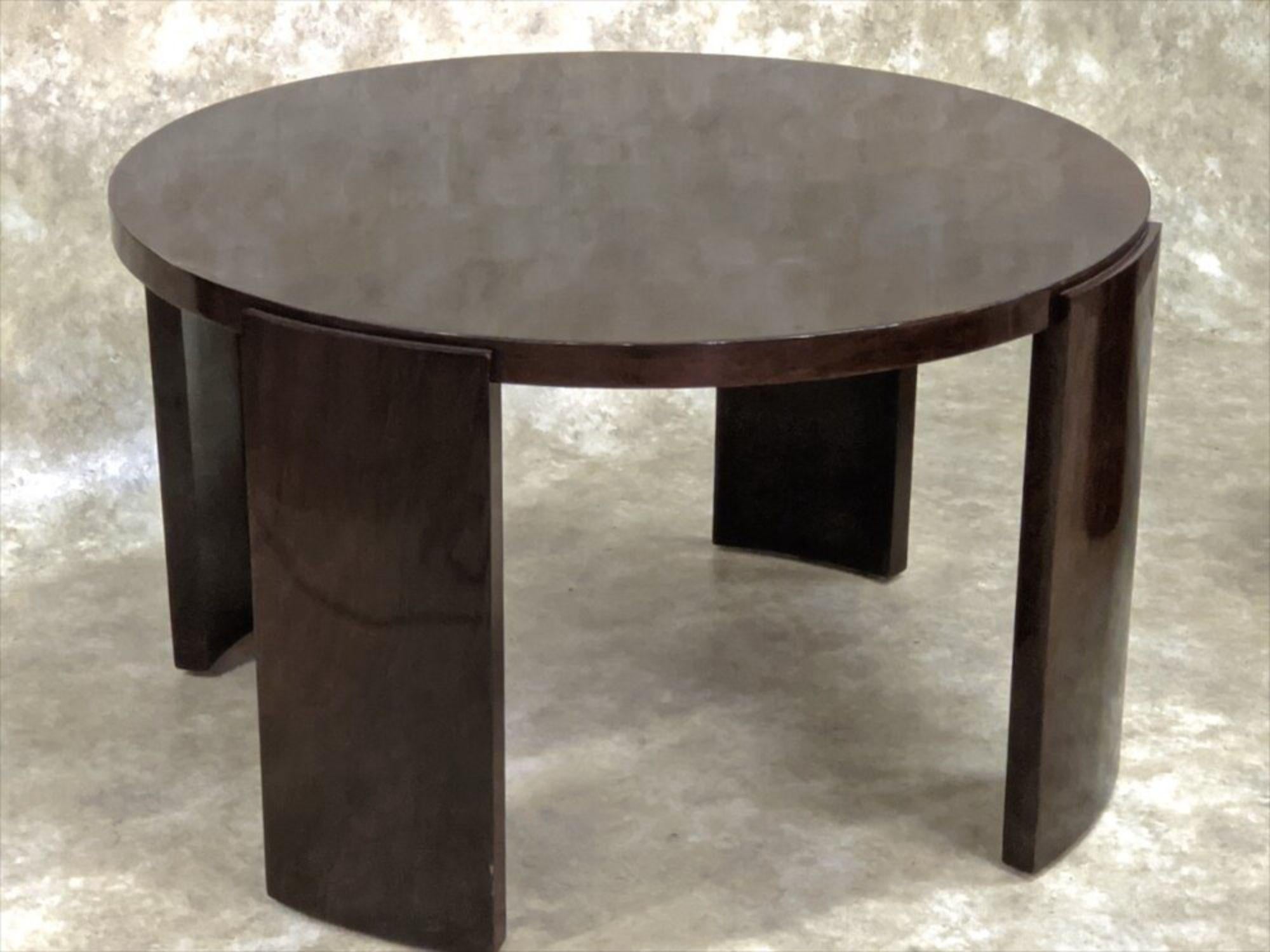 French Modernist Art Deco low round table, circa 1930 by Jacques Adnet in black rosewood. 

About 31” diameter x about 19” high.
