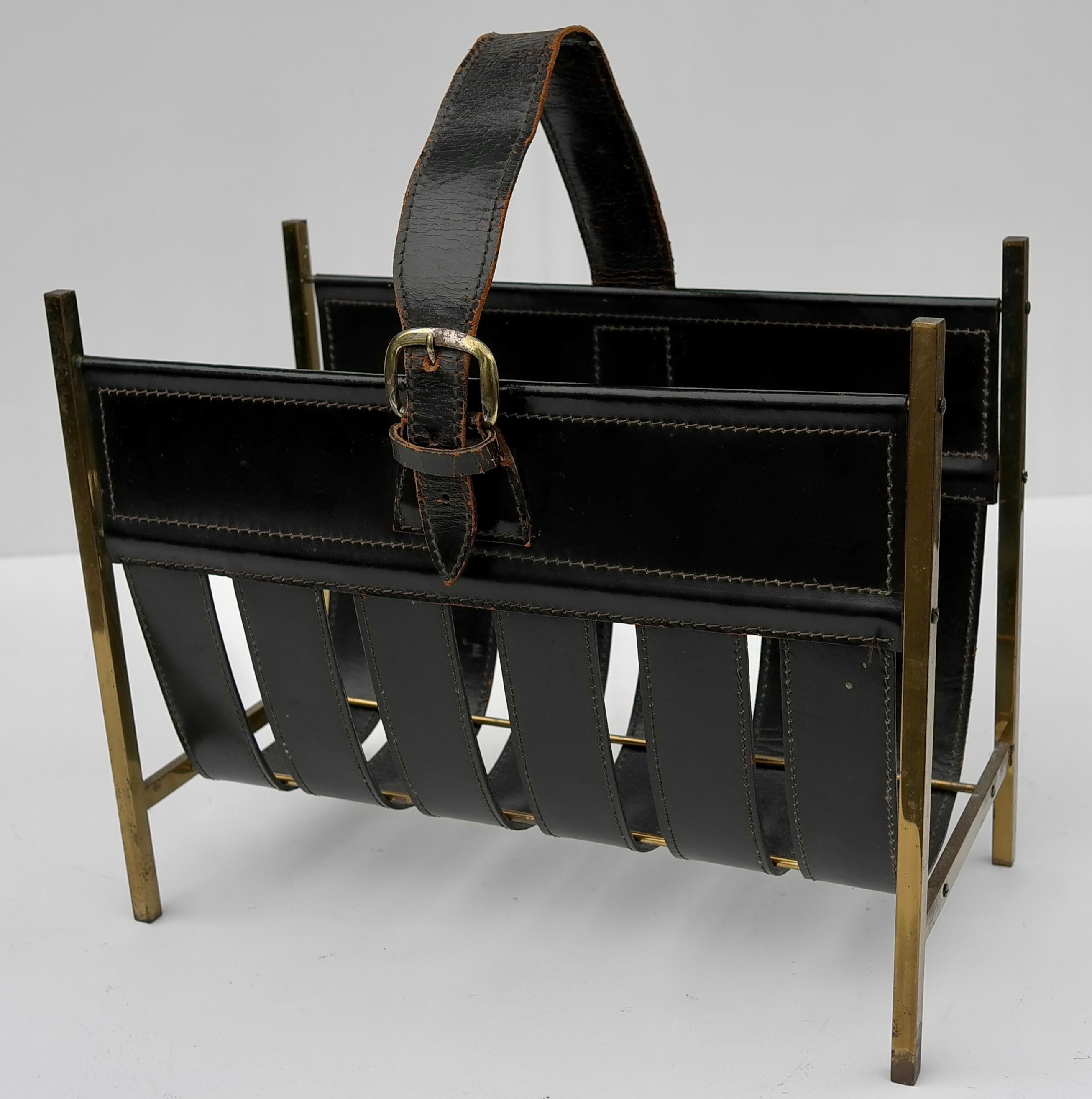 Jacques Adnet magazine rack in black sling leather and brass, France 1960's