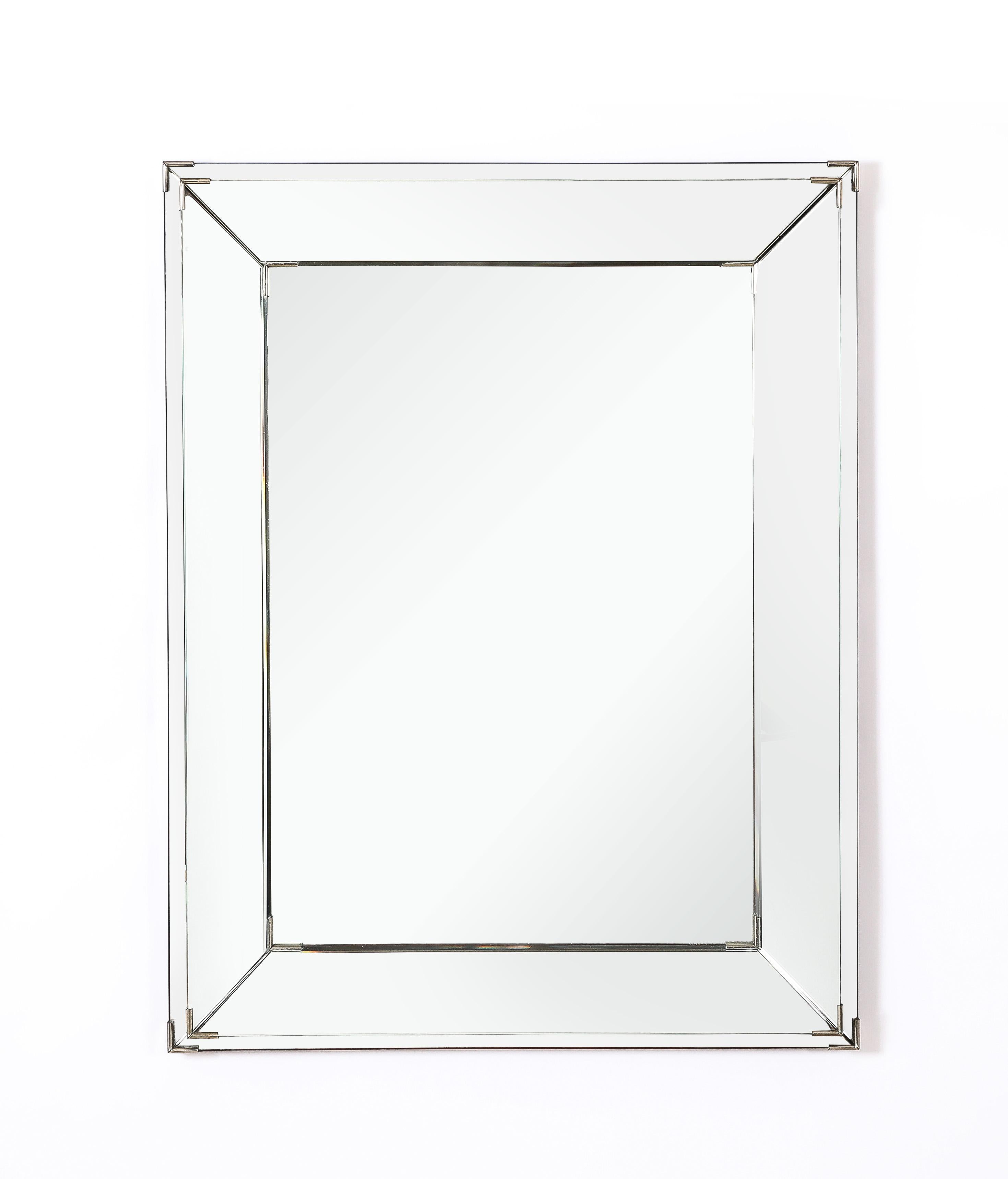 Layered mirror with nickel hardware.