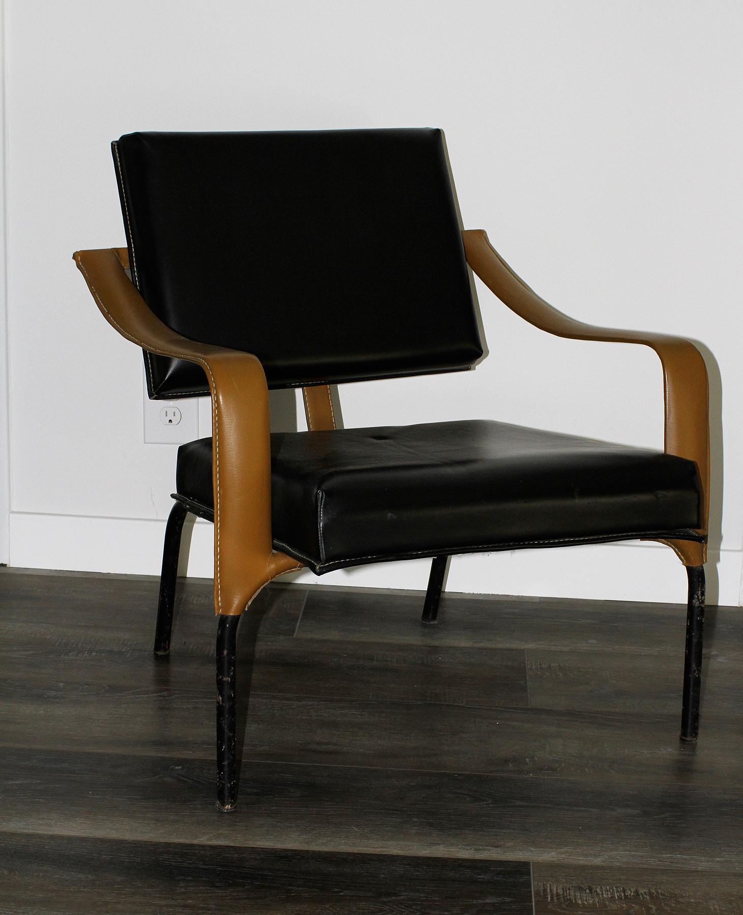 Extremely rare pair of lounge chairs by Jacques Adnet. Original condition.
France, circa 1955-1960.
Edited by Mercier Freres, Paris 12.
Black and brown faux leather on black lacquered metal
Measurements: Height 29”, height2 15”1/2, width 25”3/4,