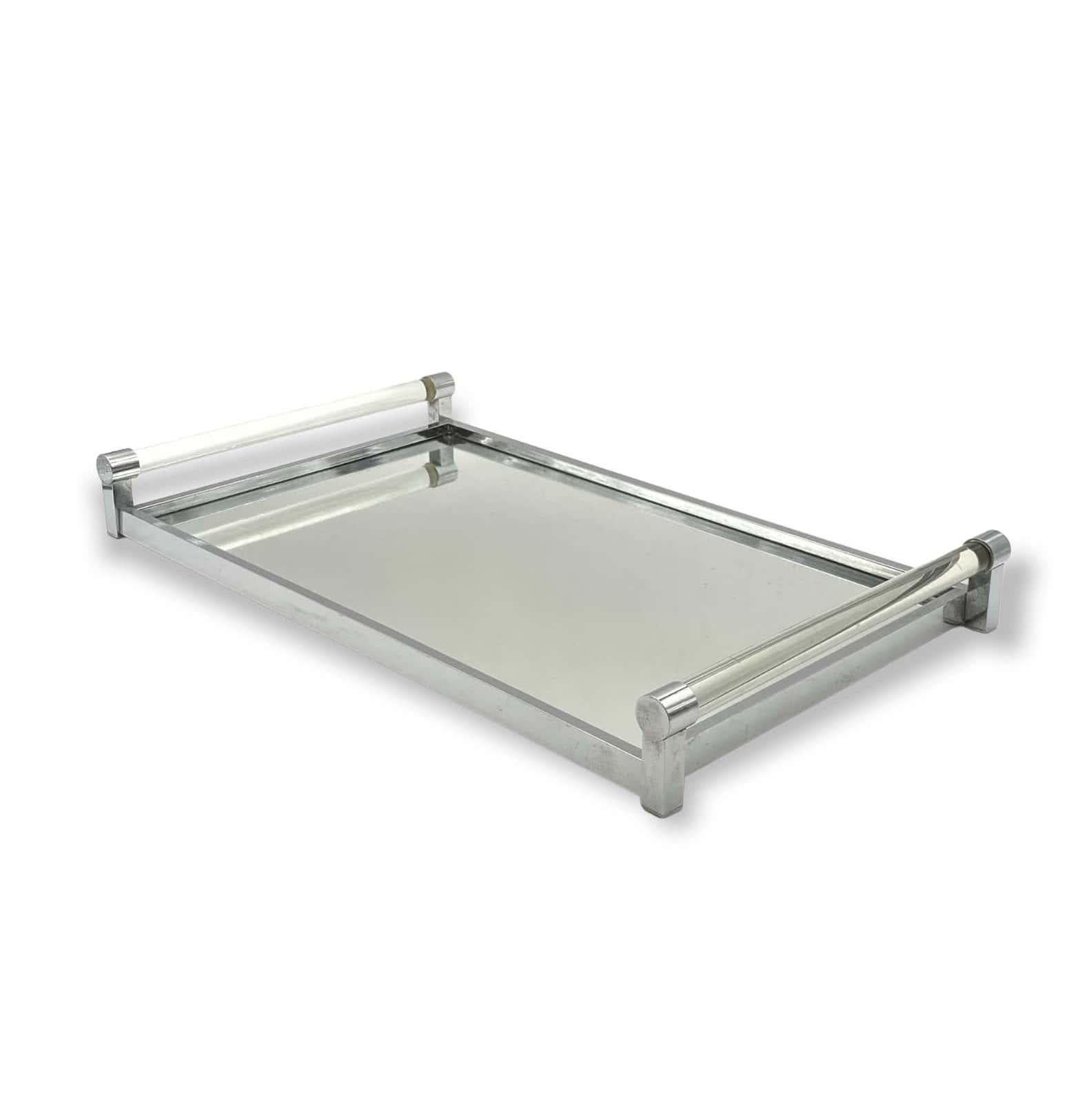 Modernist mirrored tray with lucite details

Jacques Adnet, Paris, France 1940s 

metal, glass, lucite

H 6 cm

36 x 51 cm

Conditions: very good consistent with age and use, signs of wear on the mirror.