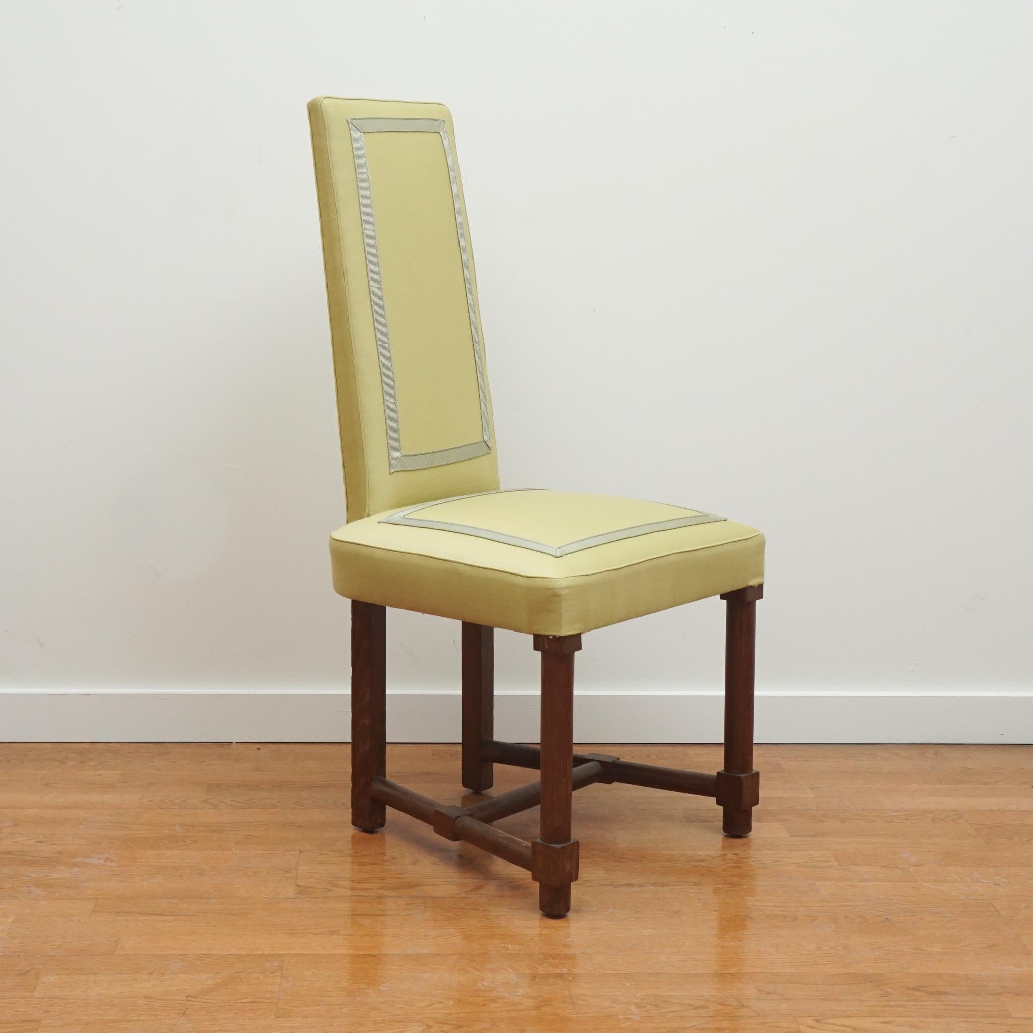 This tall back, neoclassic side chair is attributed to French designer Jacques Adnet circa 1945. The tight back and seat is enhanced with an appliqued decorative banding front and back. The chair legs offer a distinctive look as well. The Jacque