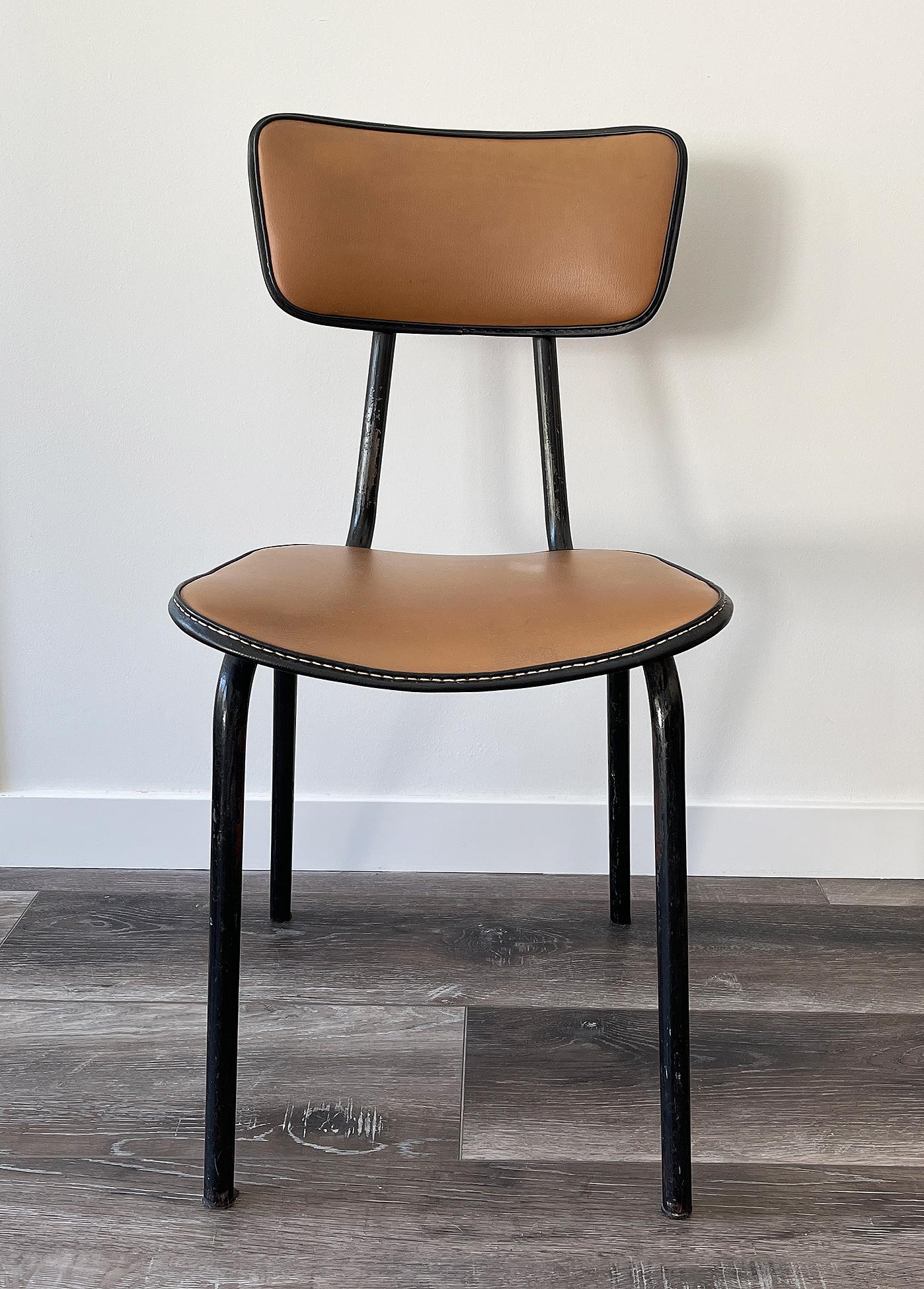 Jacques Adnet ( 1901-1984)
Original chair in black lacquered metal and faux-leather camel color upholstery and vinyl piping.
Original condition.
  