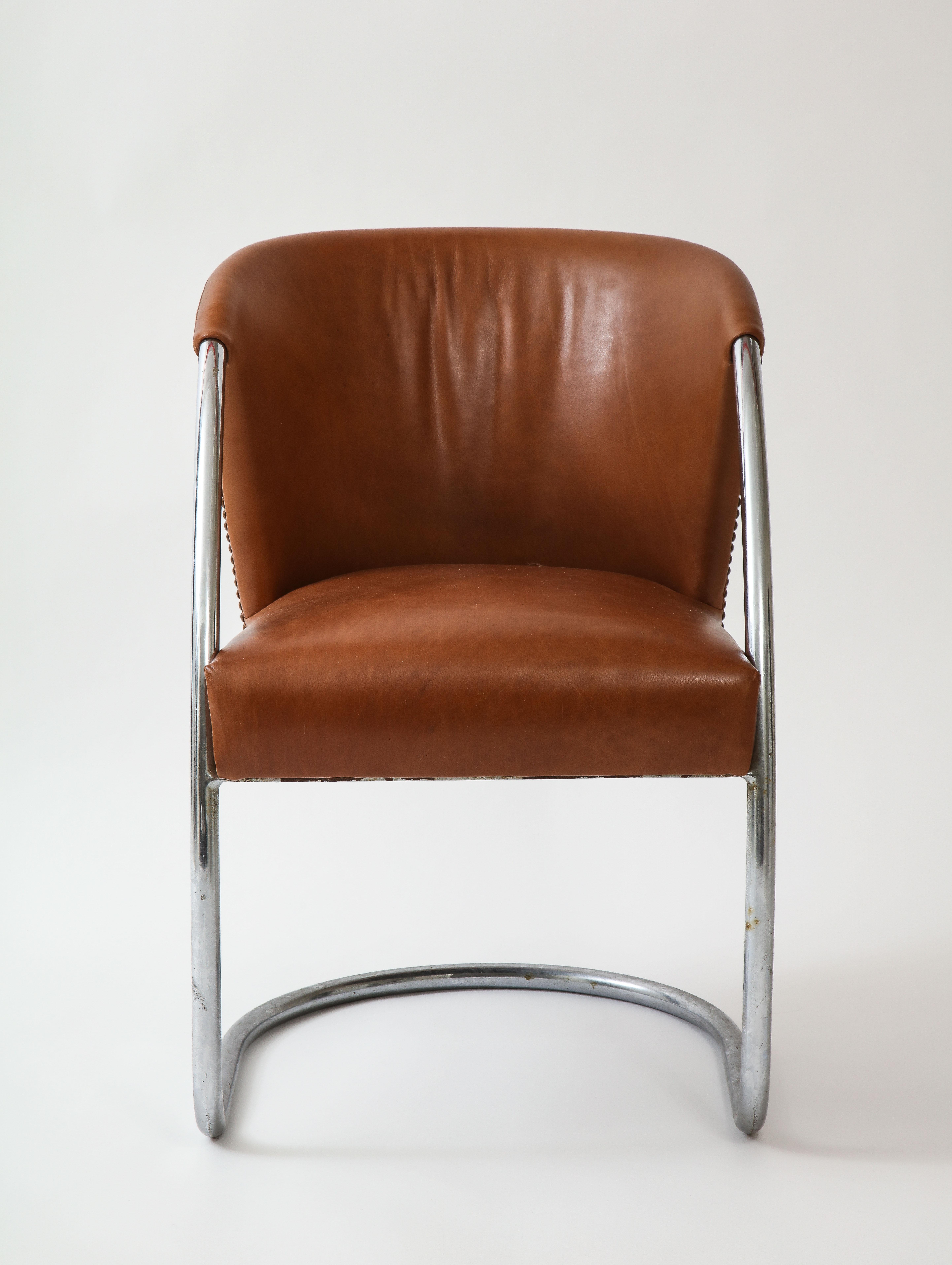 Midcentury Jacques Adnet set chrome chairs and table, France

Beautiful and chairs. The chairs have been reupholstered in brown leather. In overall good condition. 
Jacques Adnet (1900-1984): Rare modernist armchair in tubular chromed steel frame