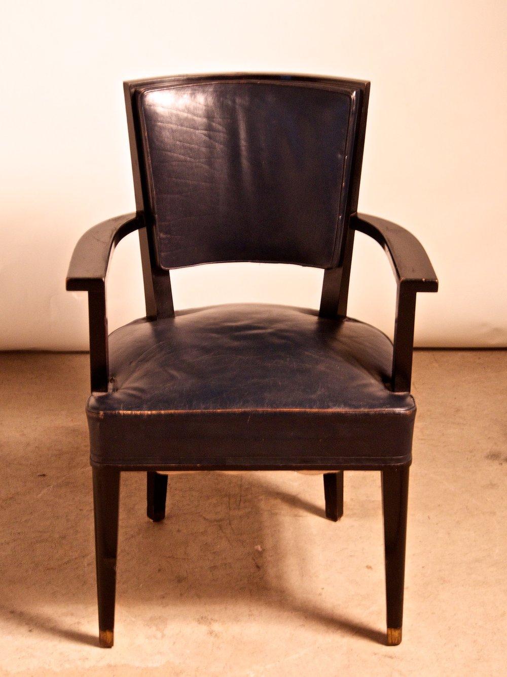 French Fortie Art Deco pair of armchairs by Jacques Adnet in black French polish with bronze mounts. 21.5” wide x 19” deep x 35” high. These chairs are unrestored in the photographs.

JACQUES ADNET

(1900-1984)

An icon of luxurious French