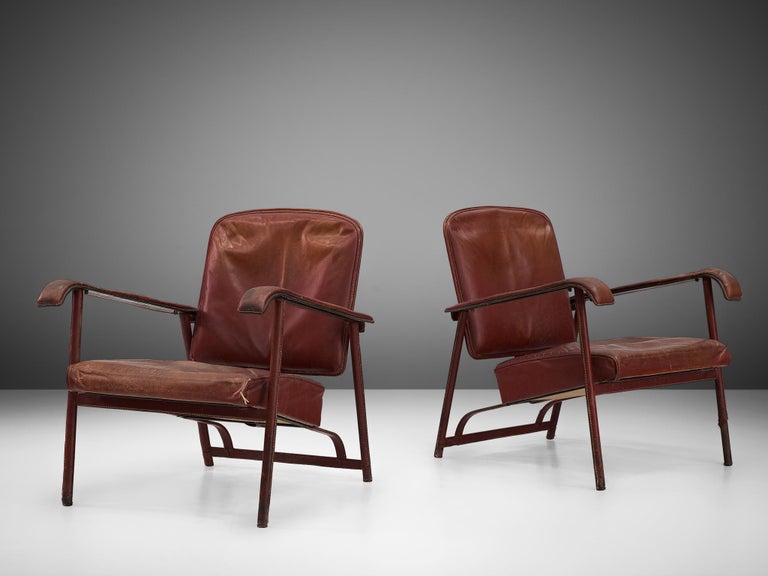 Jacques Adnet, pair of lounge chairs, leather, metal, France, late 1950s

Pair of armchairs by French designer Jacques Adnet, featuring a tubular steel frame, upholstered with patinated leather. The use of tubular steel started in the 1920s and