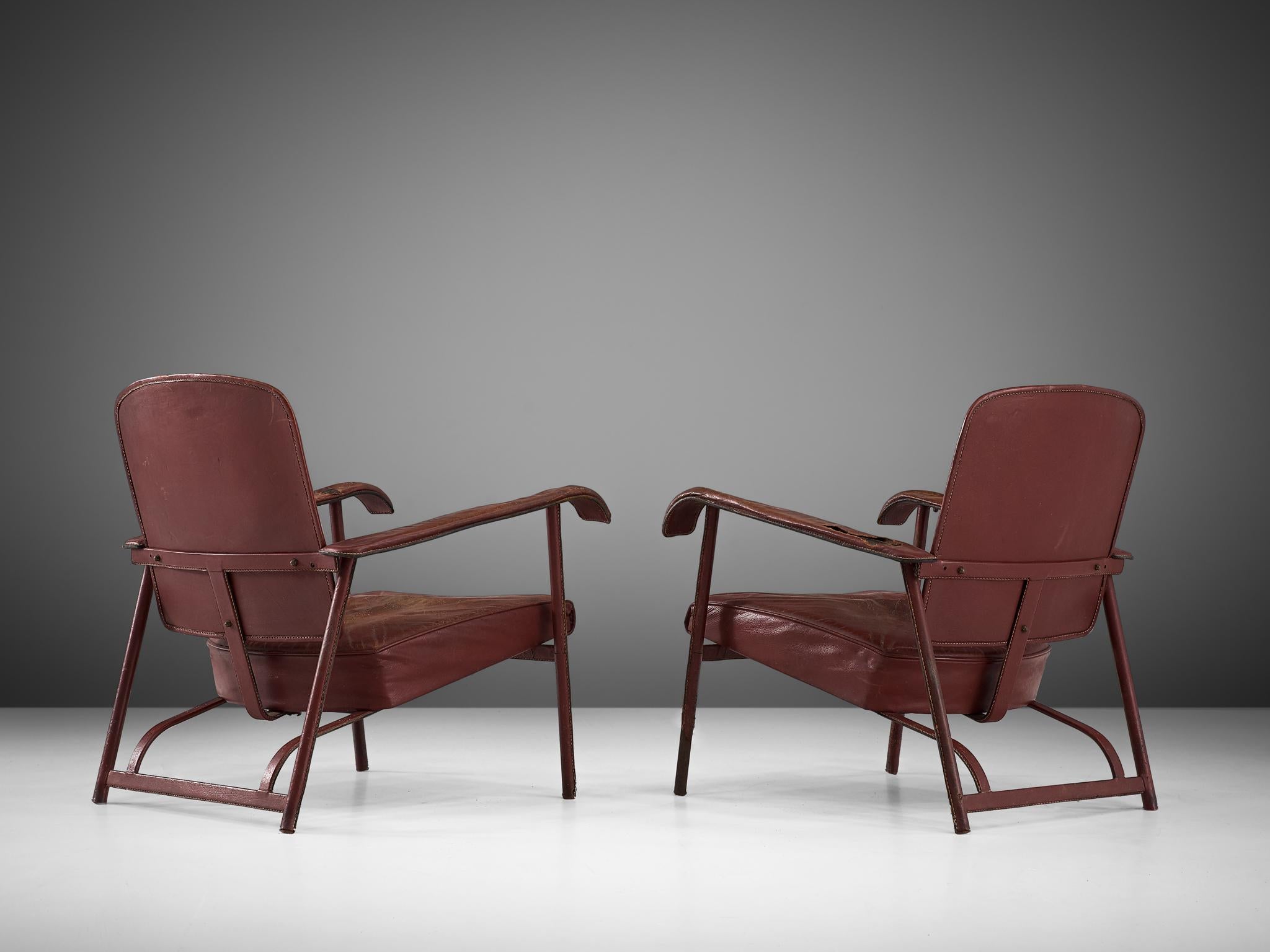 Mid-20th Century Jacques Adnet Pair of Lounge Chairs in Patinated Burgundy Leather