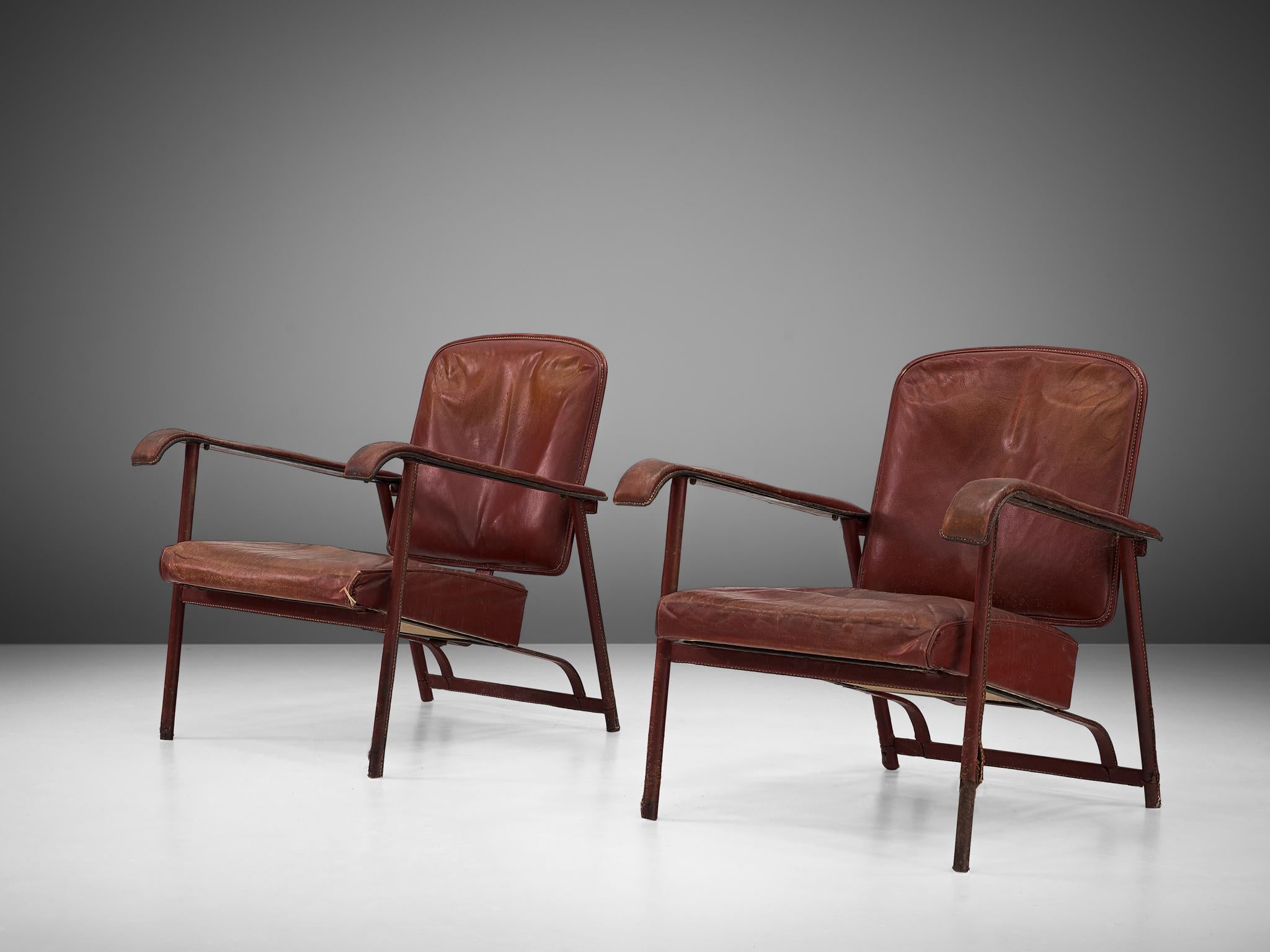 Metal Jacques Adnet Pair of Lounge Chairs in Patinated Burgundy Leather