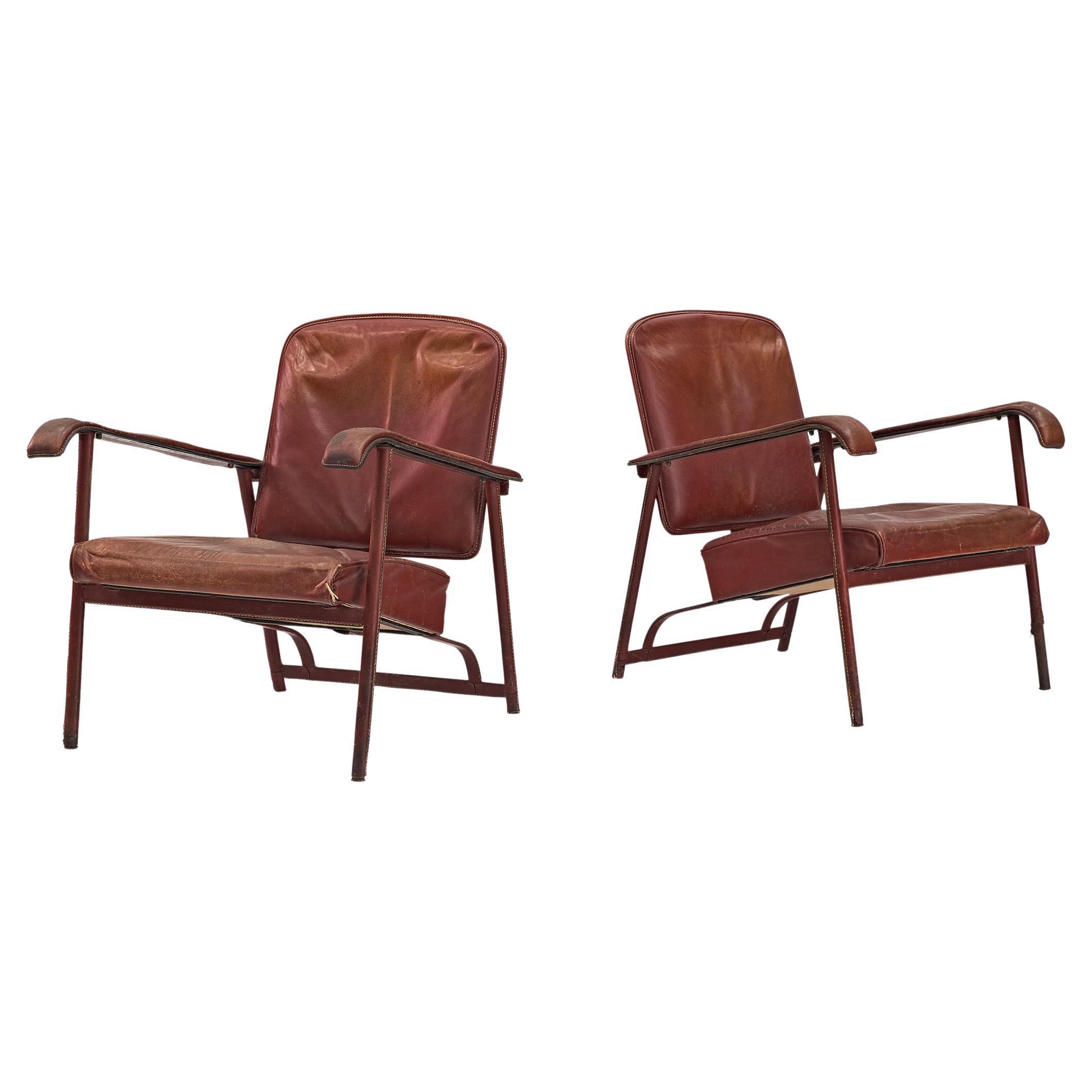 Jacques Adnet Pair of Lounge Chairs in Patinated Burgundy Leather