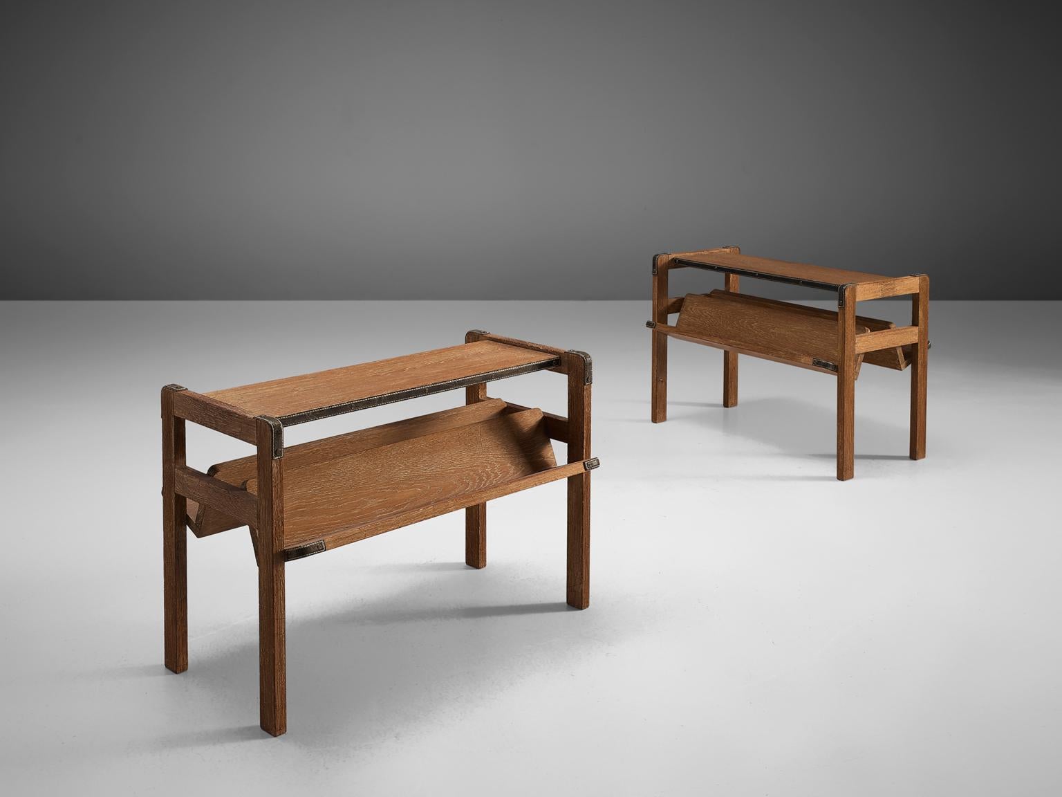 Jacques Adnet, pair of side tables, oak and leather, france, early 1930s

These coffee tables or side tables were designed in the beginning of the 1930s by Jacques Adnet, a well-known Art Deco and modernist designer. The set is composed of a solid