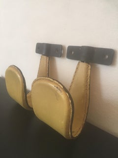 Jacques Adnet Pair of Yellow Stitched Leather Coat Hooks, French, 1950s