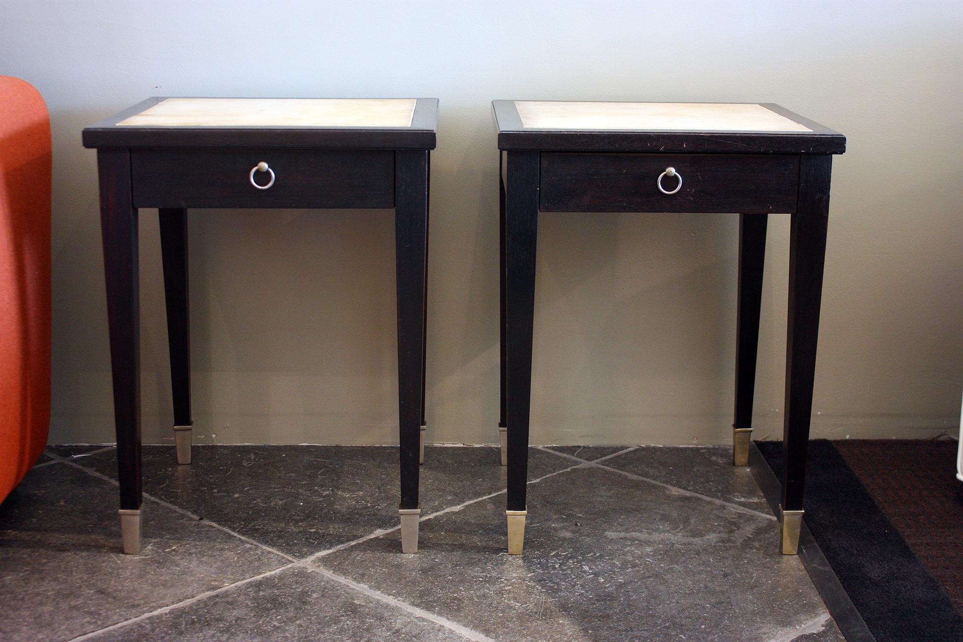 Jacques Adnet, (1900-1984)
Very rare pair of side tables in black lacquered wood, parchment, and silver plated bronze sabots. Each has one drawer with an oxidized brass ring handle.
France, 1940.
Drawer is in beach wood and ash. Structure is in a
