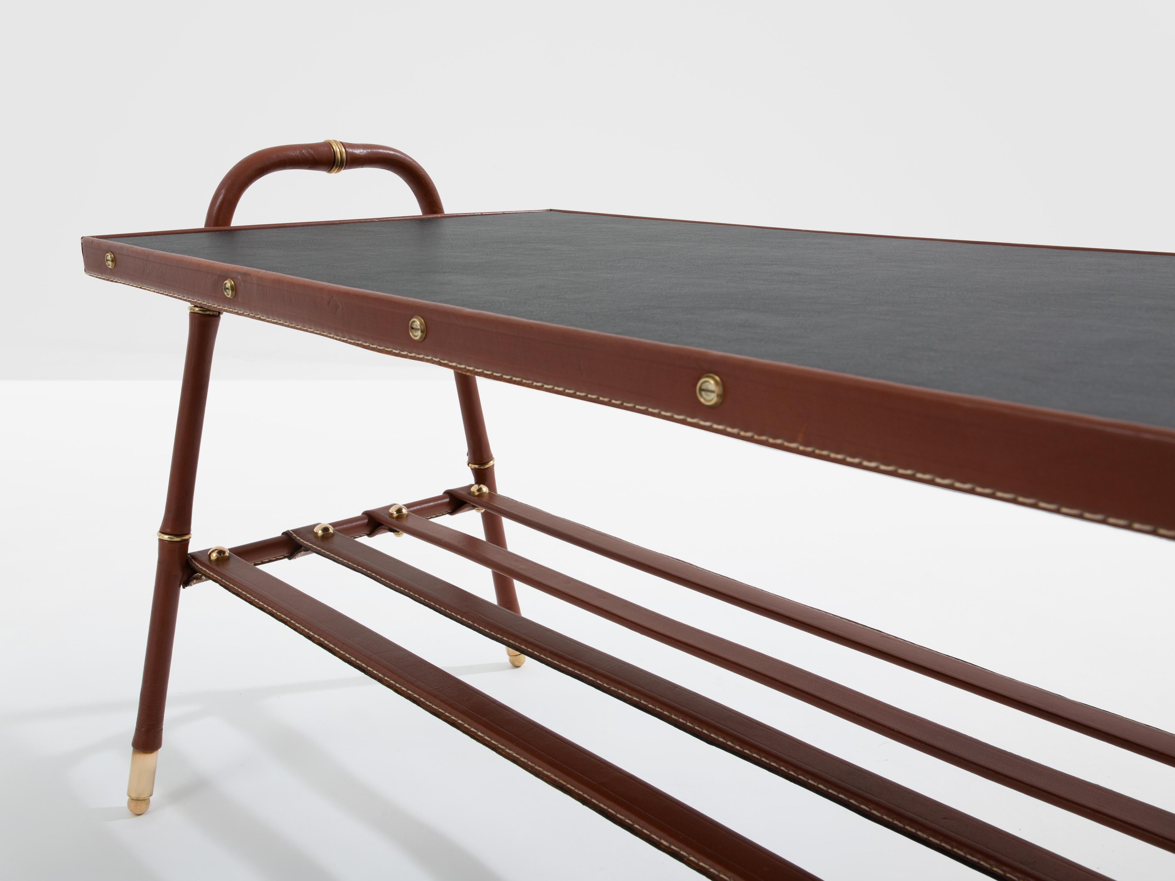 Mid-20th Century Jacques Adnet pique sellier red leather brass coffee table 1950 For Sale