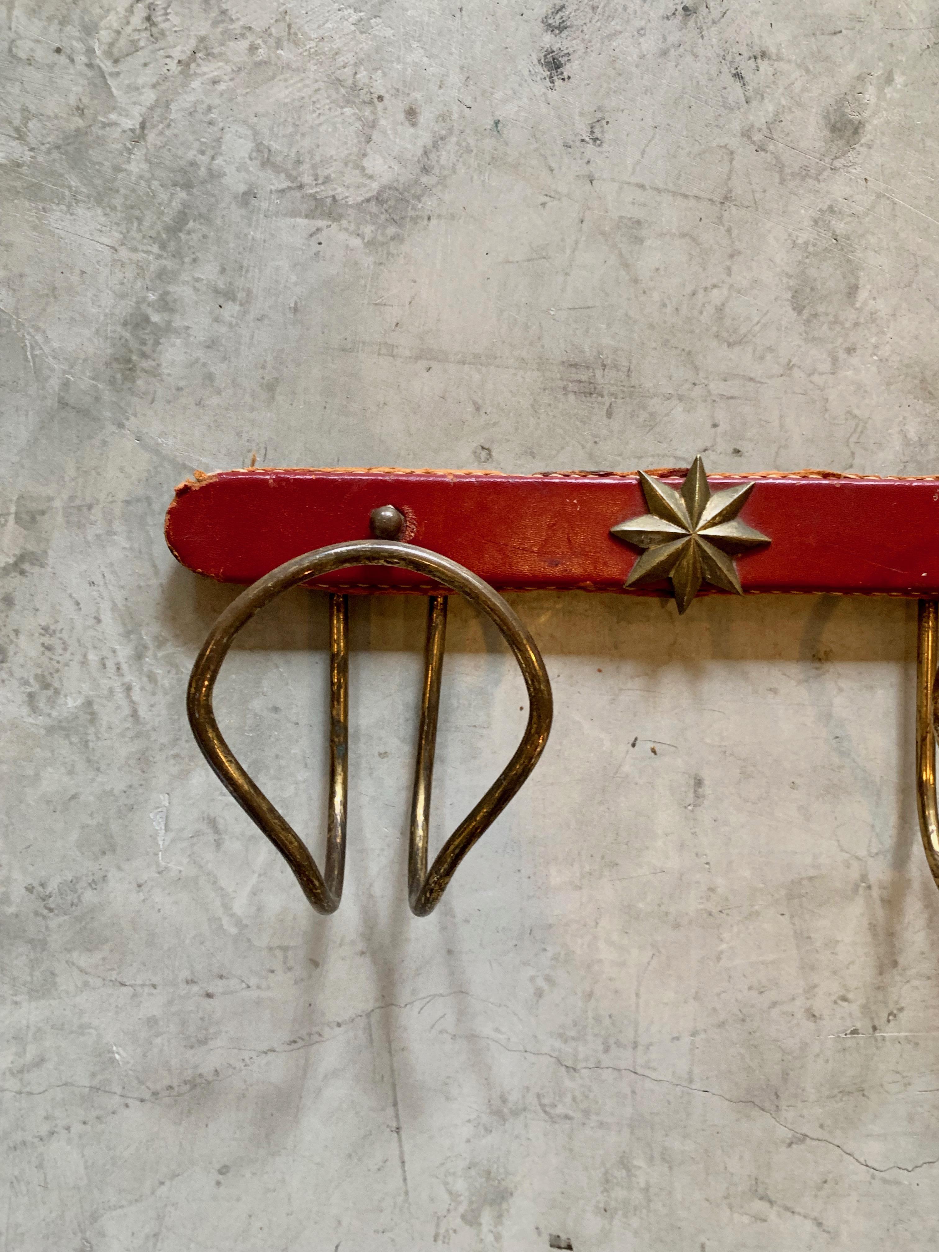Mid-20th Century Jacques Adnet Red Leather and Brass Coat Rack