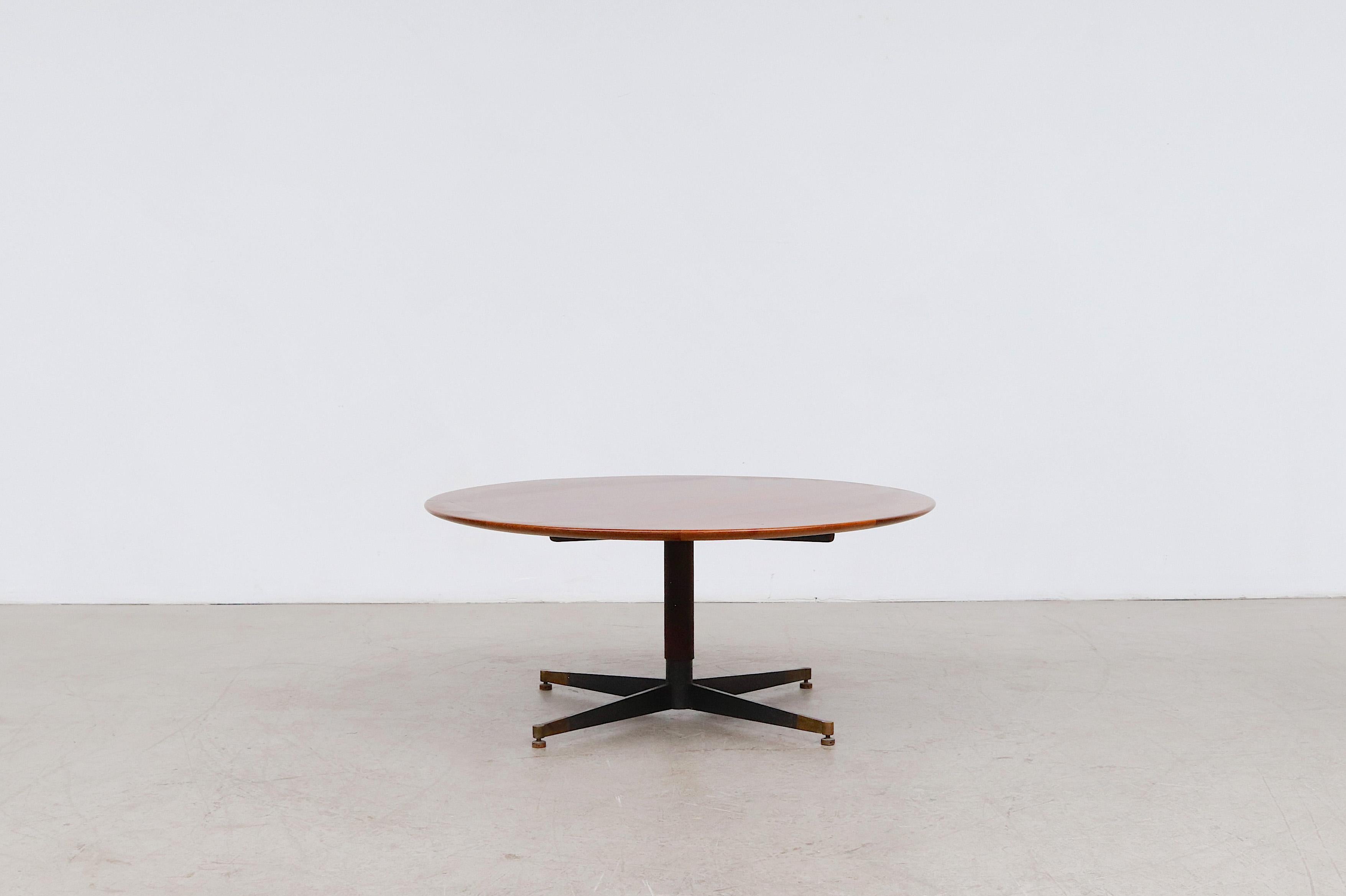 Beautiful mid-century Jacques Adnet attributed round side or coffee table with leather wrapped metal pedestal base. Lovely teak top with beautiful wood grain, leather wrapped post and patinated brass feet. In original condition with some base wear