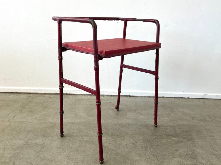 Jacques Adnet side table in original red leather, signature contrast stitching, skaii leatherette top and brass bamboo legs/ feet.

   