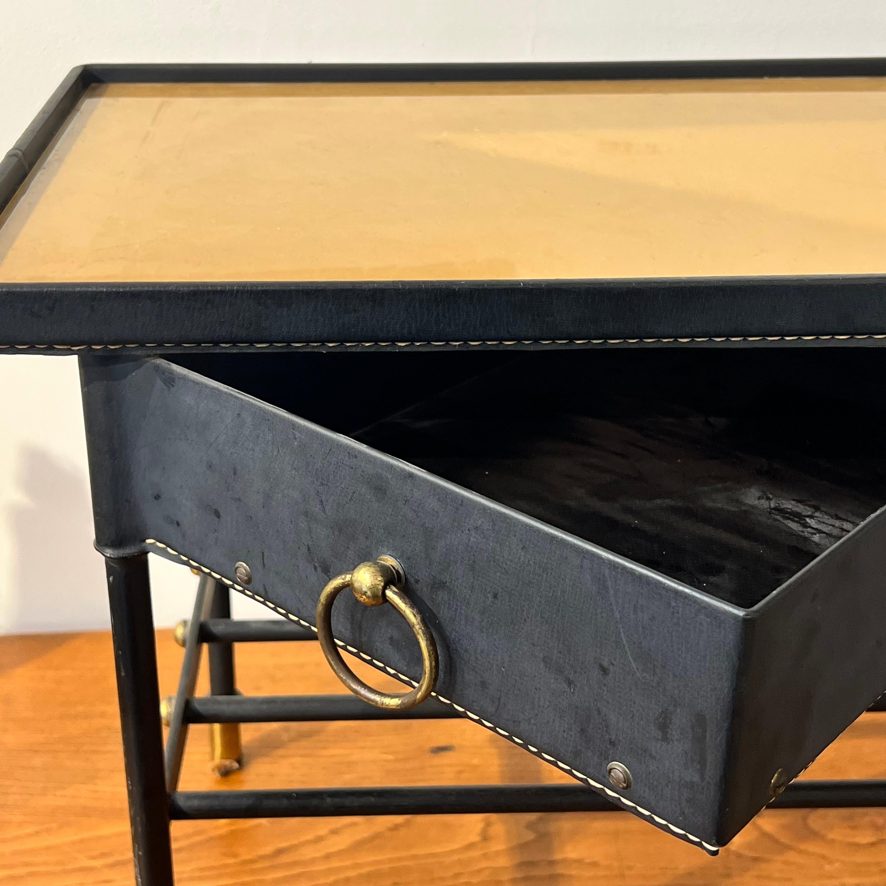 Jacques Adnet side table, leather metal and glass

Very good condition with original leather

Around 1950s

Adnet is known for his very elegant furnitures