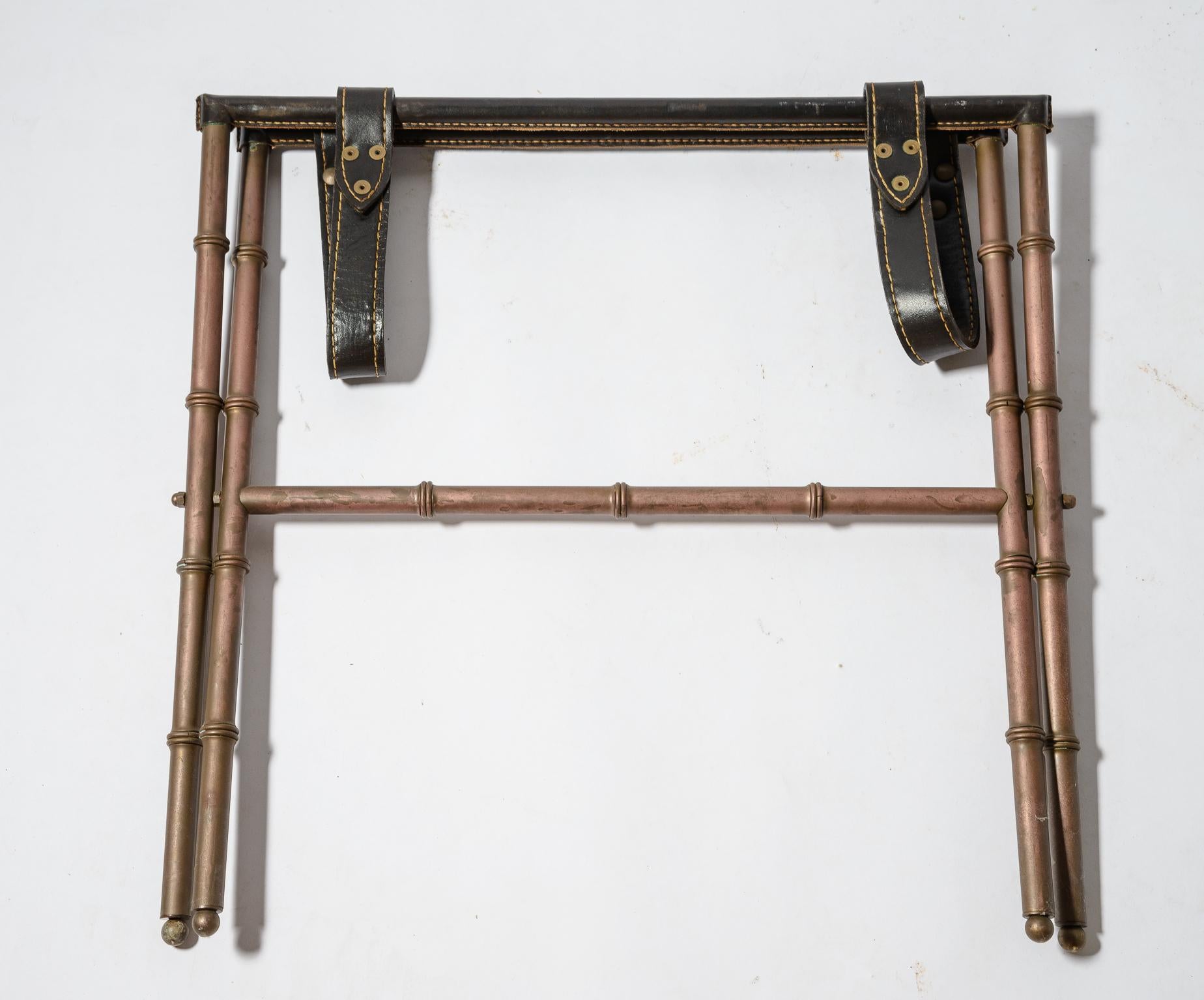 Jacques Adnet Stitched Leather and Brass Luggage Stand
Original Leather
Nice patina to brass faux Bamboo folding frame