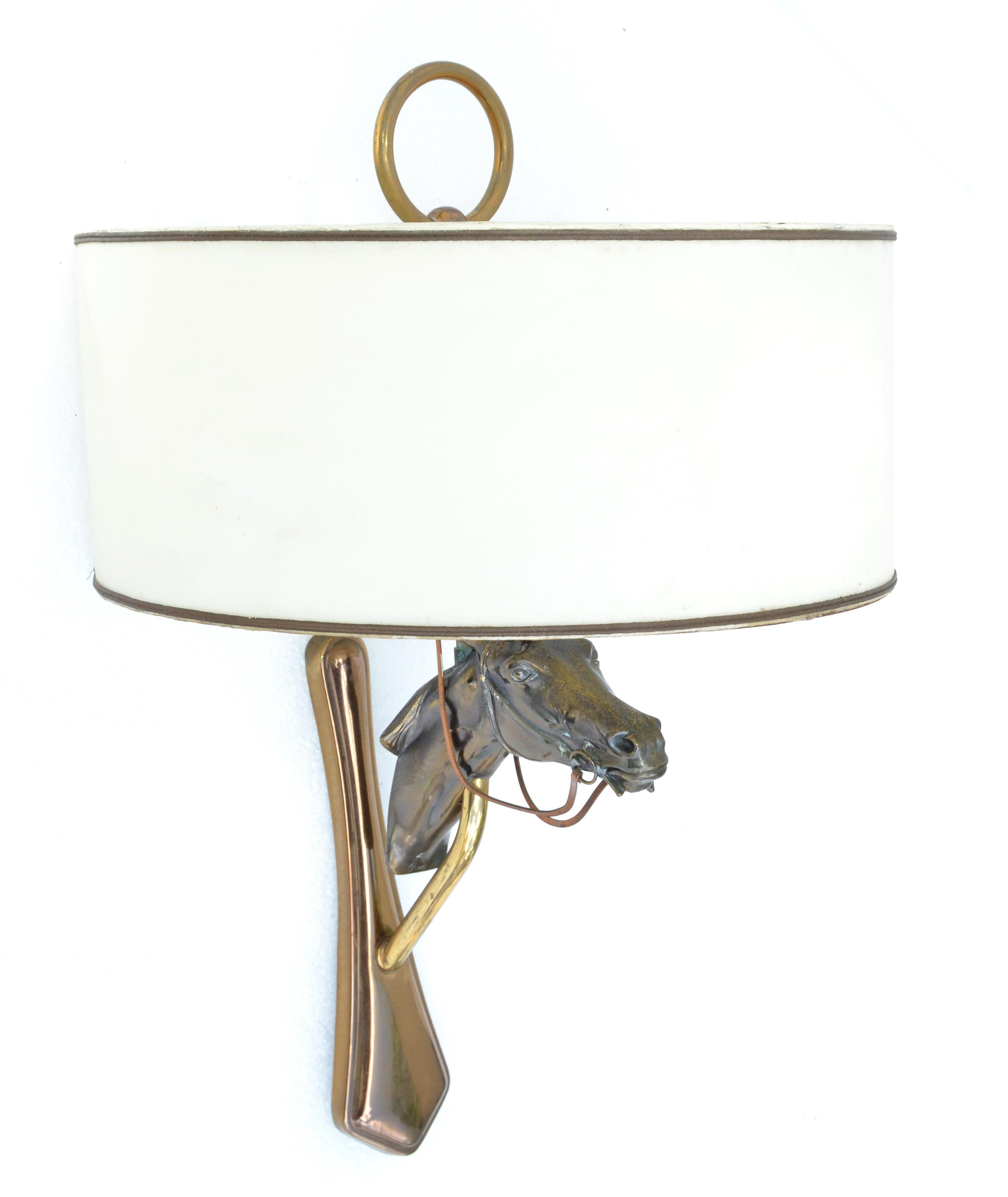 Jacques Adnet style neoclassical bronze horse head sconce, wall light, lamp with form fit original shade.
In perfect working condition and takes 2 light bulb max. 40 watts, or LED bulb.
Brass back plate measures: 9 x 2.5 inches.
Shade measures: