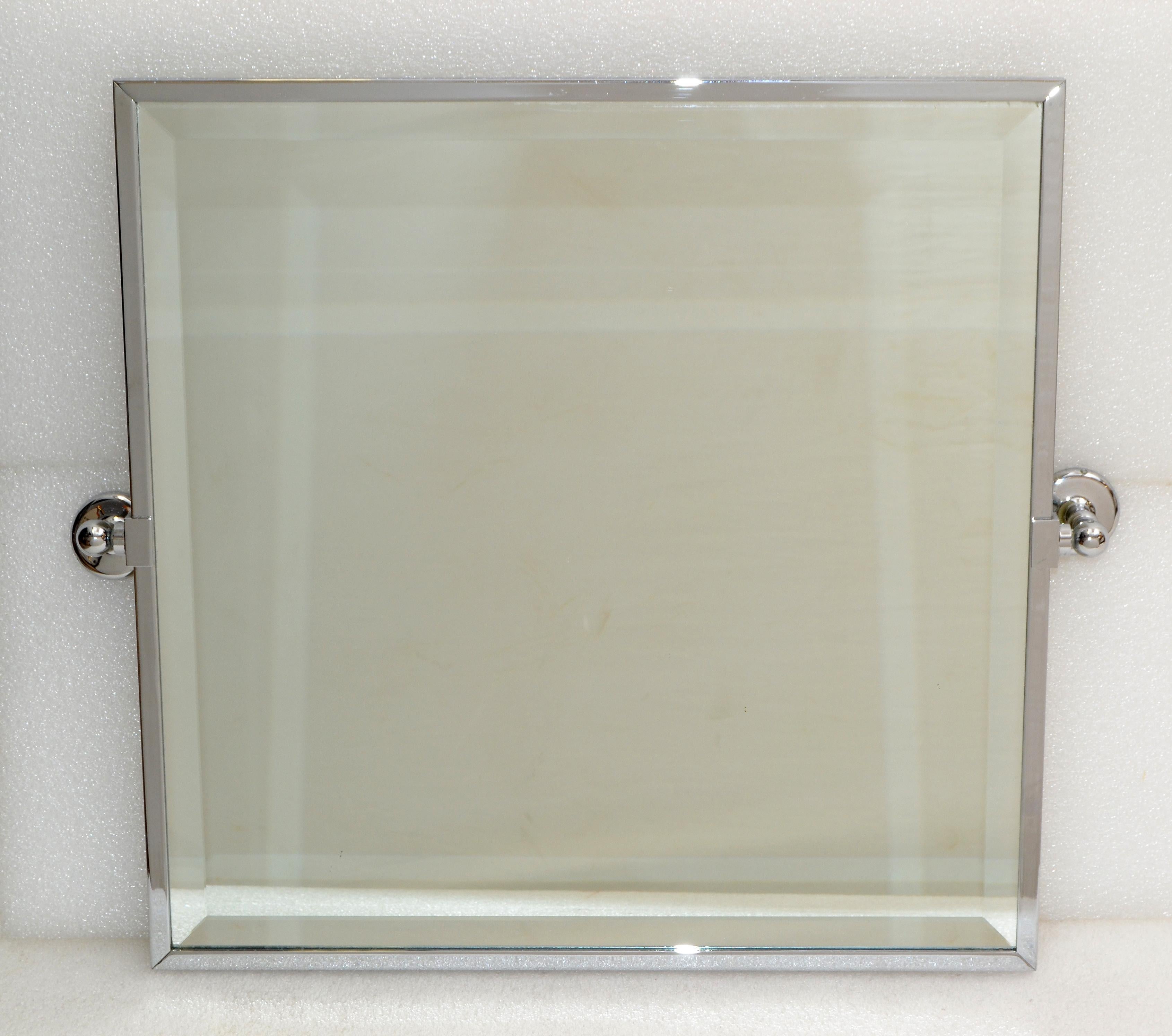 Beveled square mirror in the style of Jacques Adnet from the 1970s, in polished chrome.
Mirror measures: 20 x 20 inches.
The Mirror will be mounted to the wall.