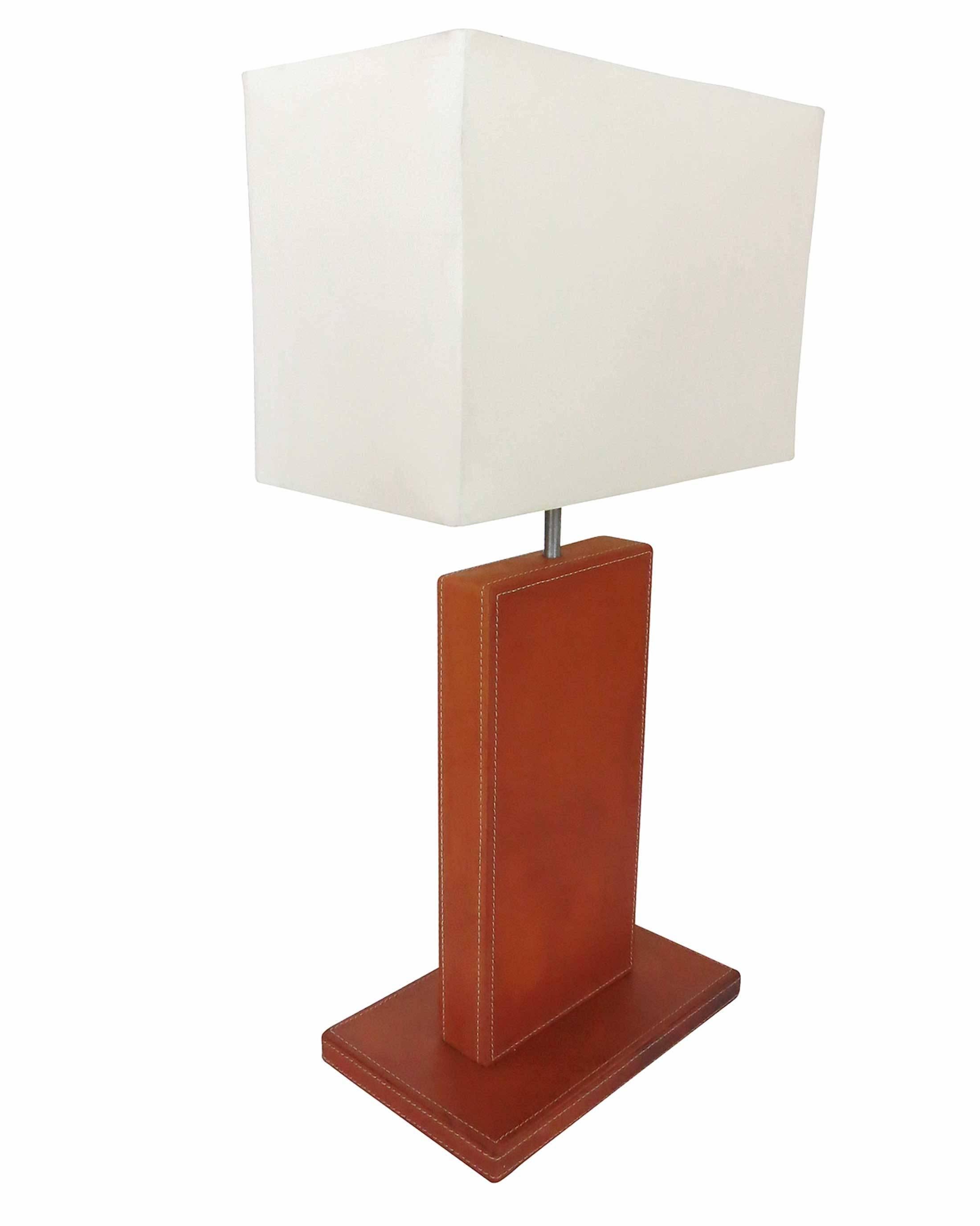 Striking Jacques Adnet style table lamp with handstitched leather base. 

Comes with square white lamp shade. 

Attributed to Jacques Adnet for Herme`s. Unsigned

Shade is 12