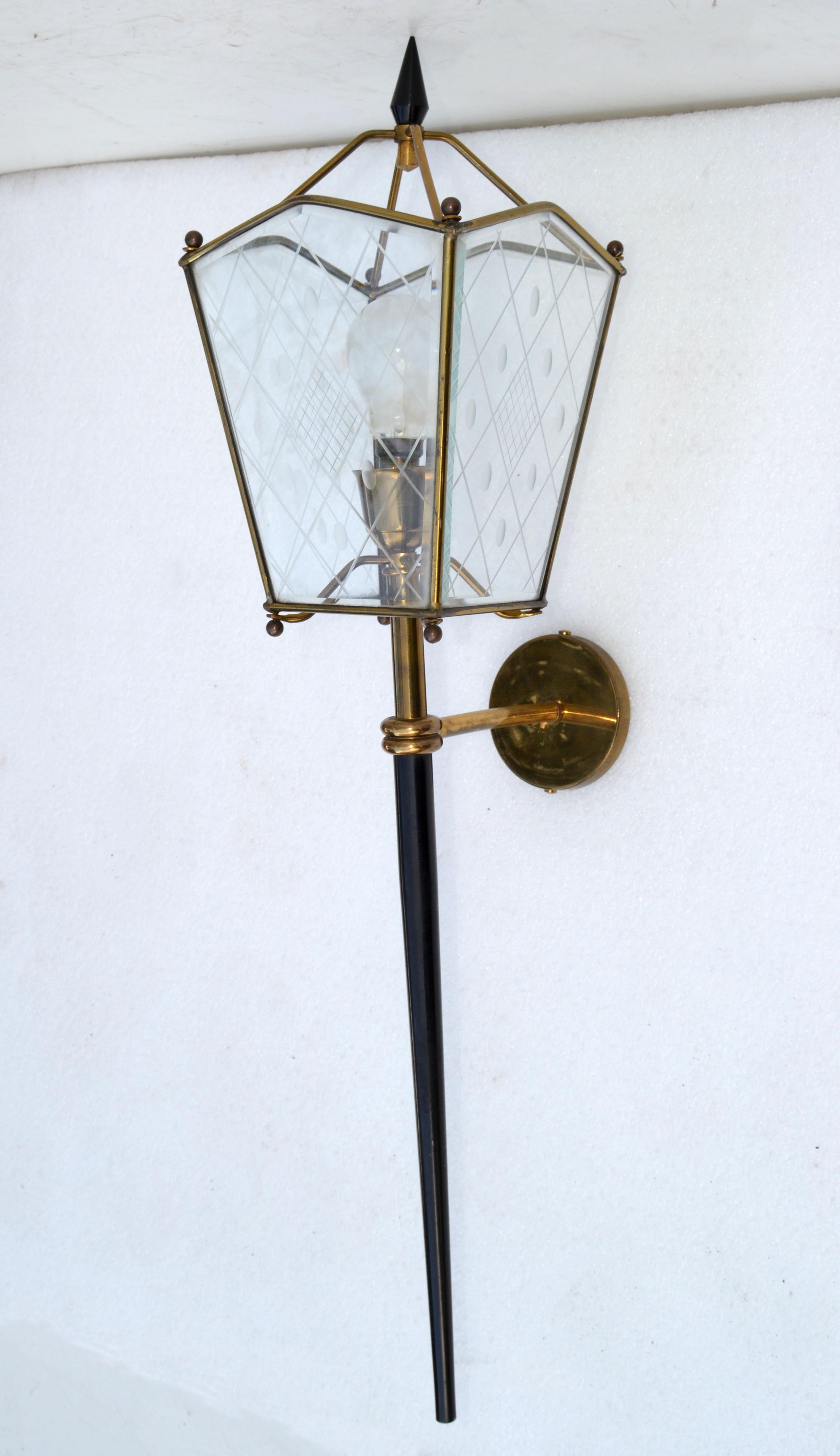 Pair of Jacques Adnet style sconces, wall lights, lantern lamps in brass, etched glass and gun metal, this is the largest size, measures 31 inches height. 
In perfect working condition, Sconce takes 1 light bulb max. 40 watts, or LED