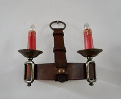 Applique murale de style Jacques Adnet en cuir et fer forgé