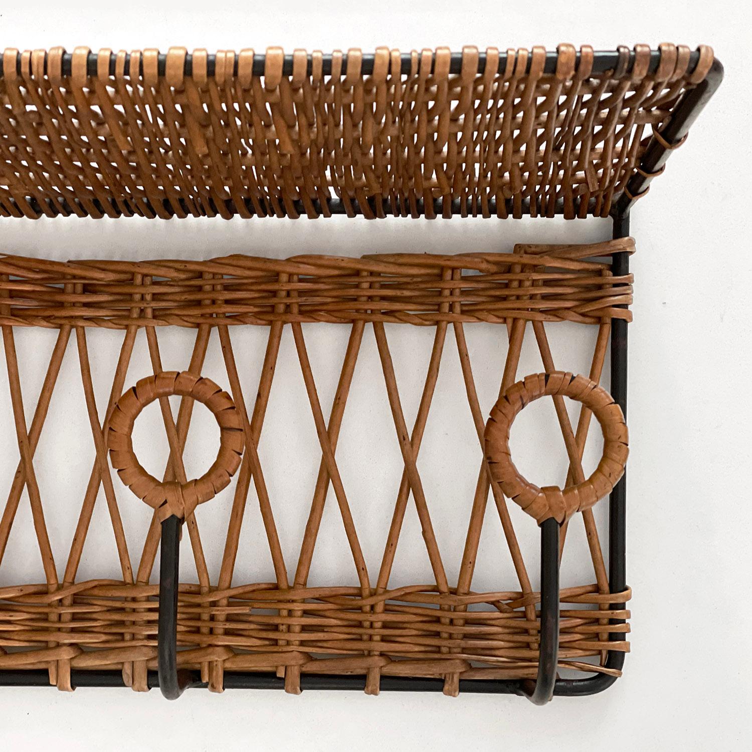 French wicker and iron coatrack in the style of Jacques Adnet 
France, circa 1960's 
Unique woven diamond pattern design
Four individually wrapped coat hooks with upper storage shelf.