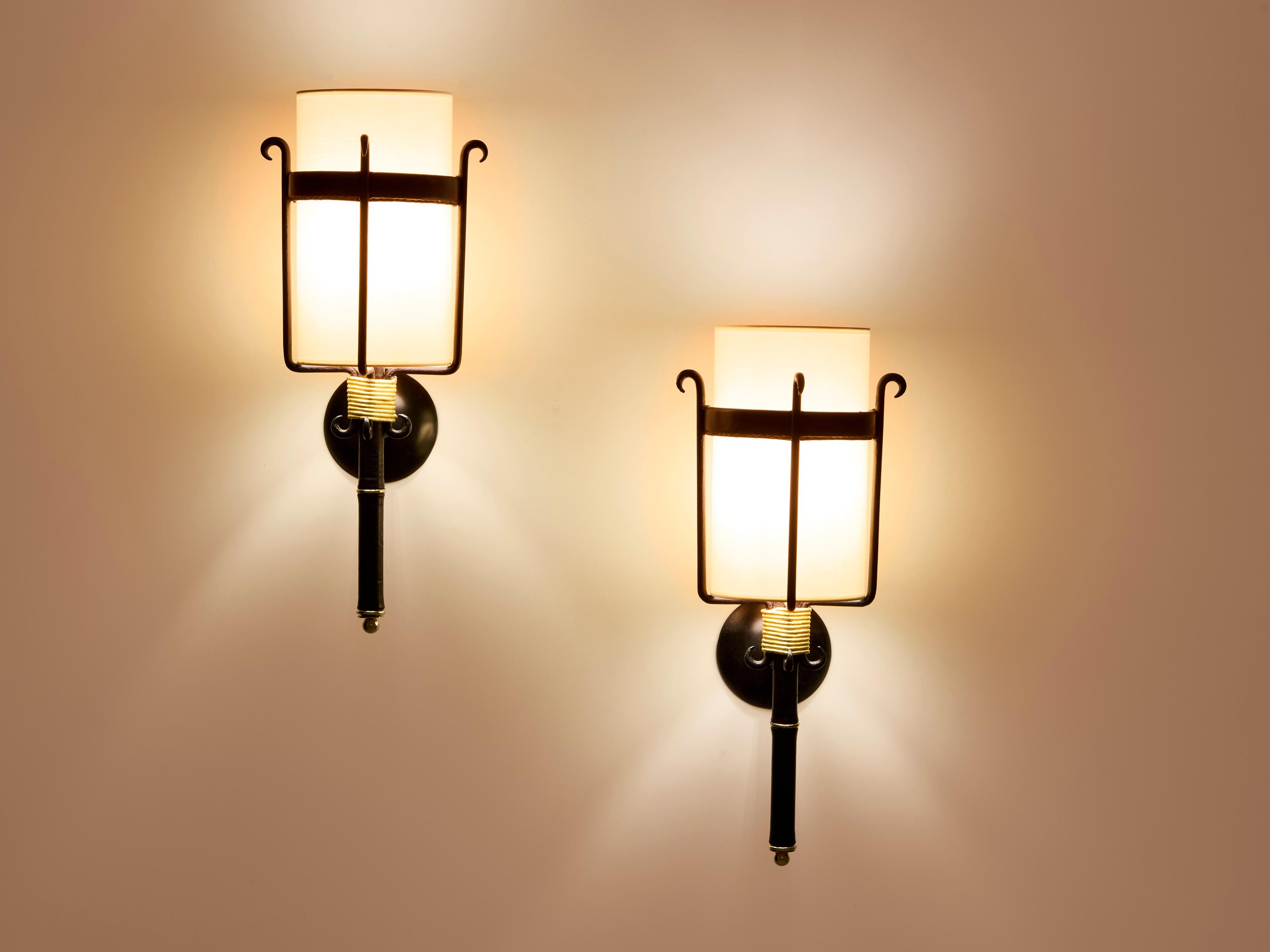 Brass Jacques Adnet wrought iron leather and brass wall lights 1950