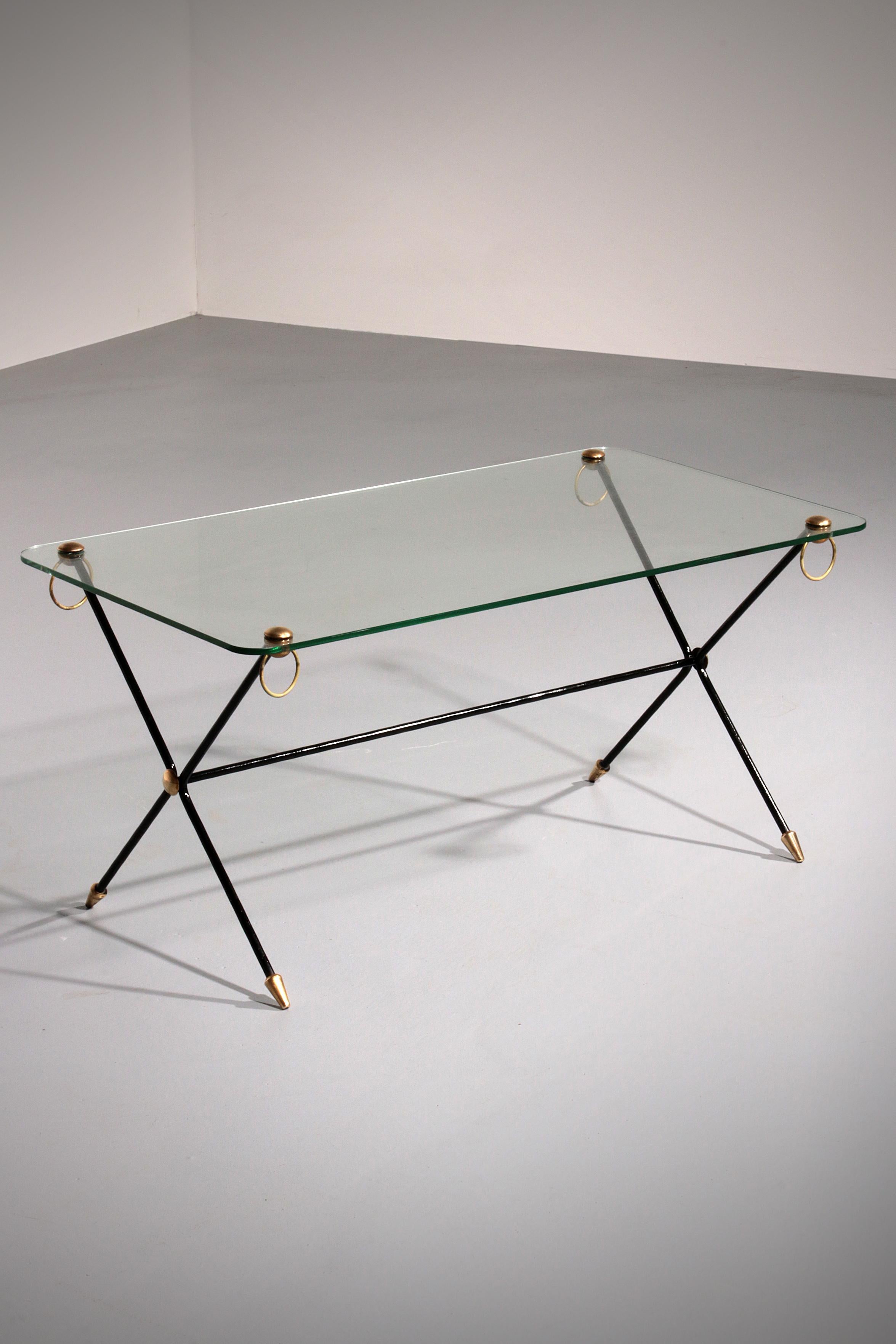 Discover the timeless elegance of the Jacques Adnet X-Base Coffee Table, a stunning piece from the 1960s that embodies the essence of French modernism. This exquisite coffee table features a unique X-shaped design with sleek black metal legs,