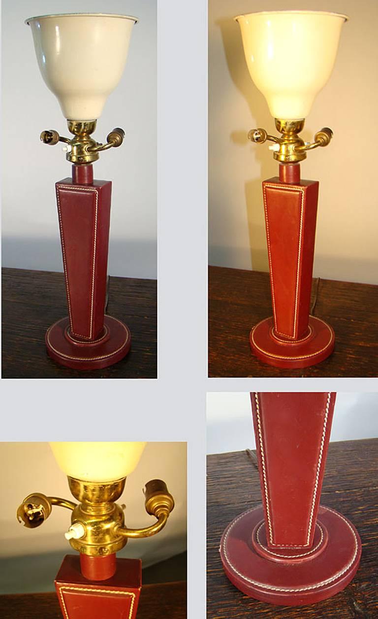 Jacques Adnet, table lamp sheathed with red Hermès style leather, circa 1940-1950.