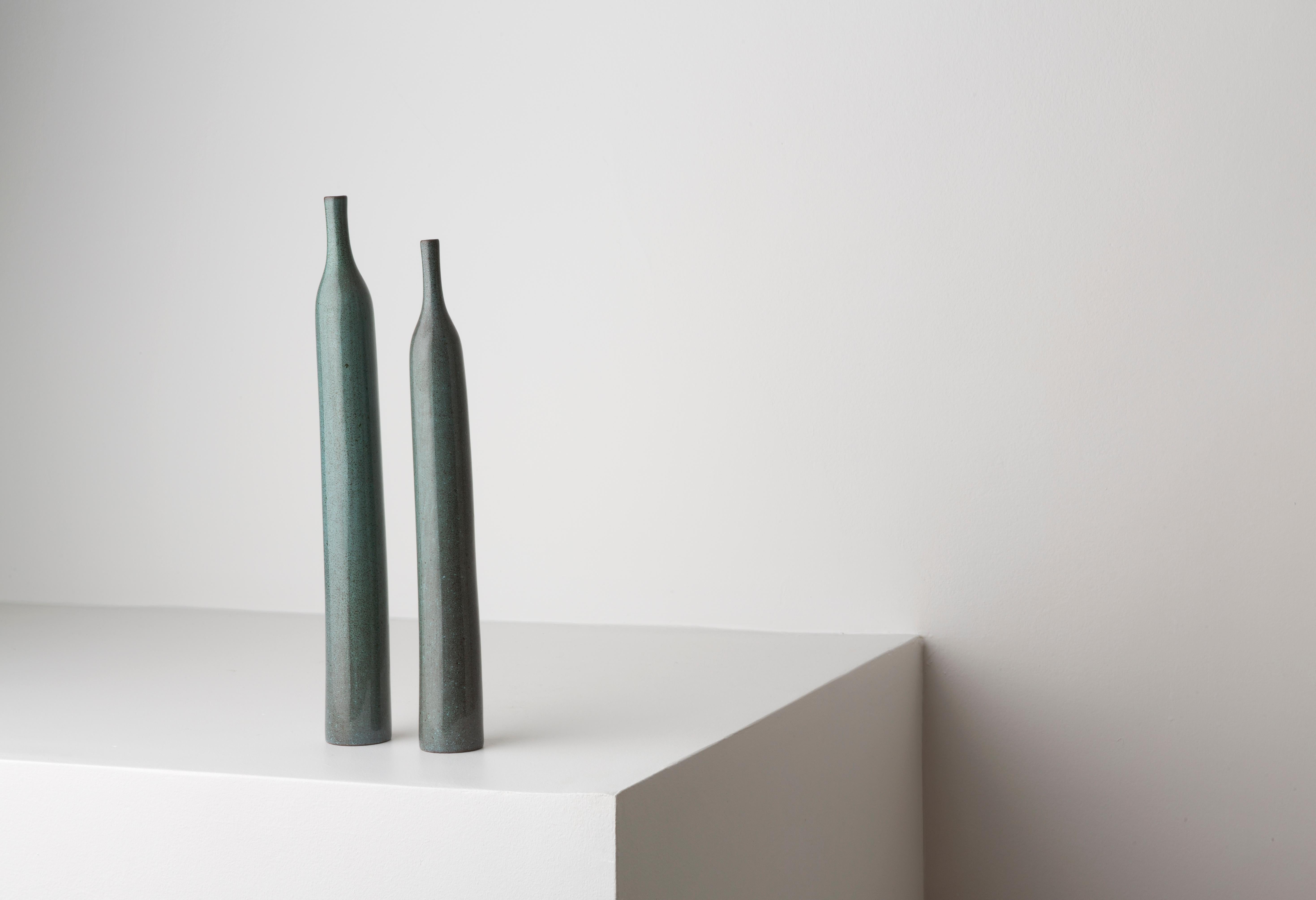 Two bottles by the couple Jacques & Dani Reulland, in blue shaded glazed stoneware, realized in their own workshop, incised with artist’s signature « Ruelland » under the base, circa 1965.