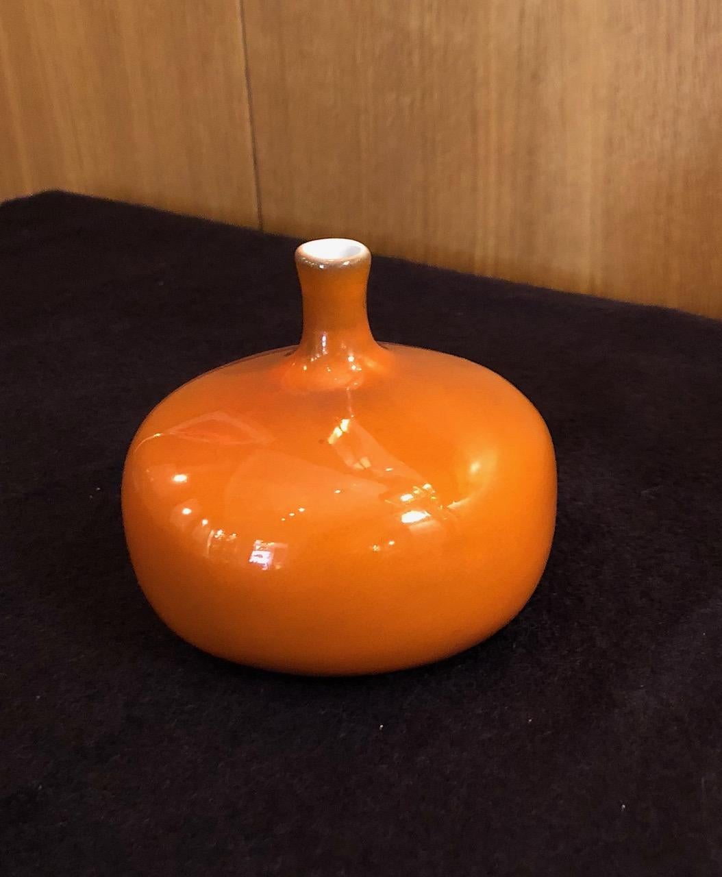 Vase by the French ceramic artists Jacques and Dani Ruelland. An orange glaze. Signed.