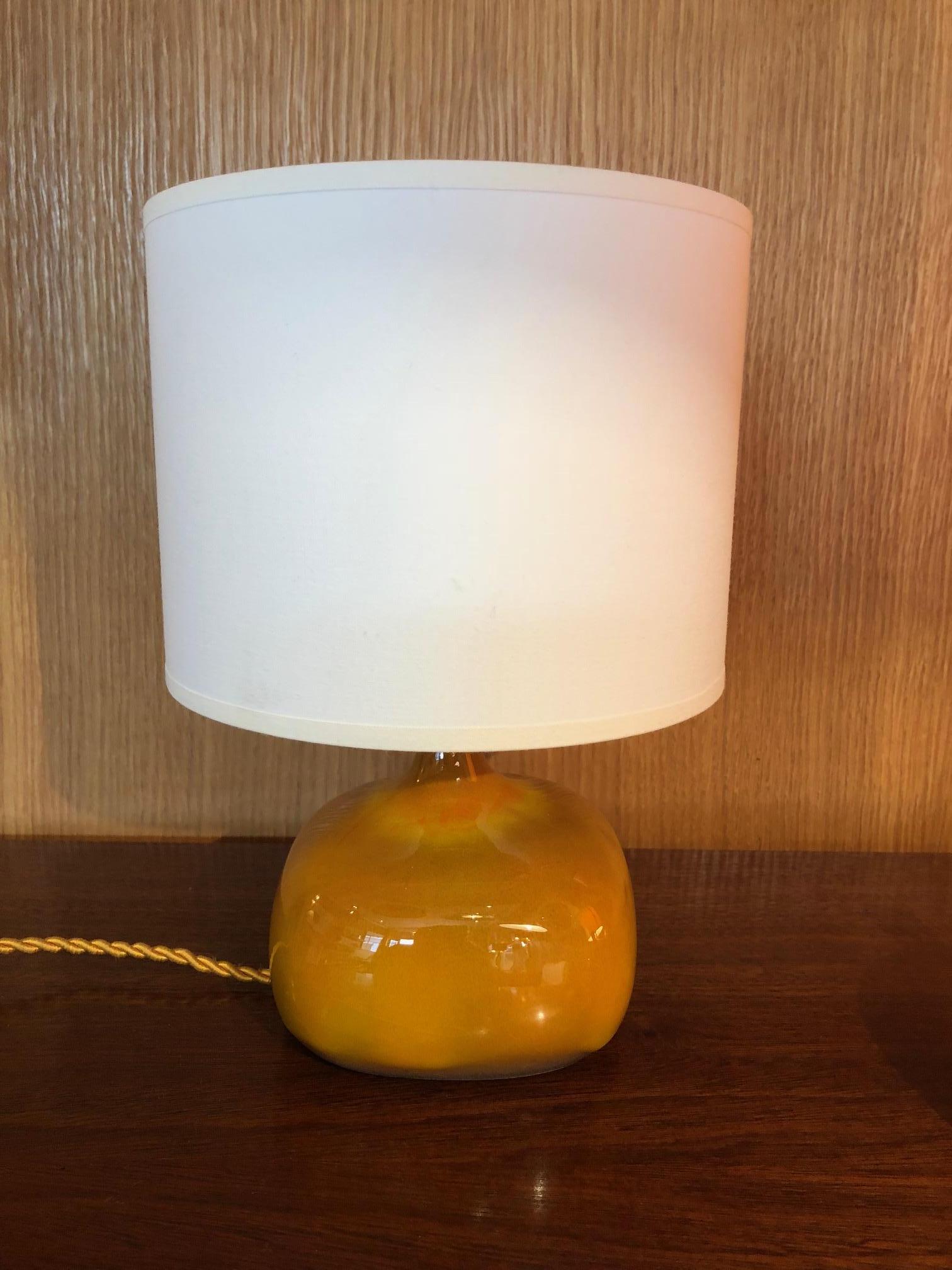 A lamp by the French ceramic artists Jacques and Dani Ruelland. A yellow orange glaze. Signed.
Dimensions indicated below are without lampshade.
