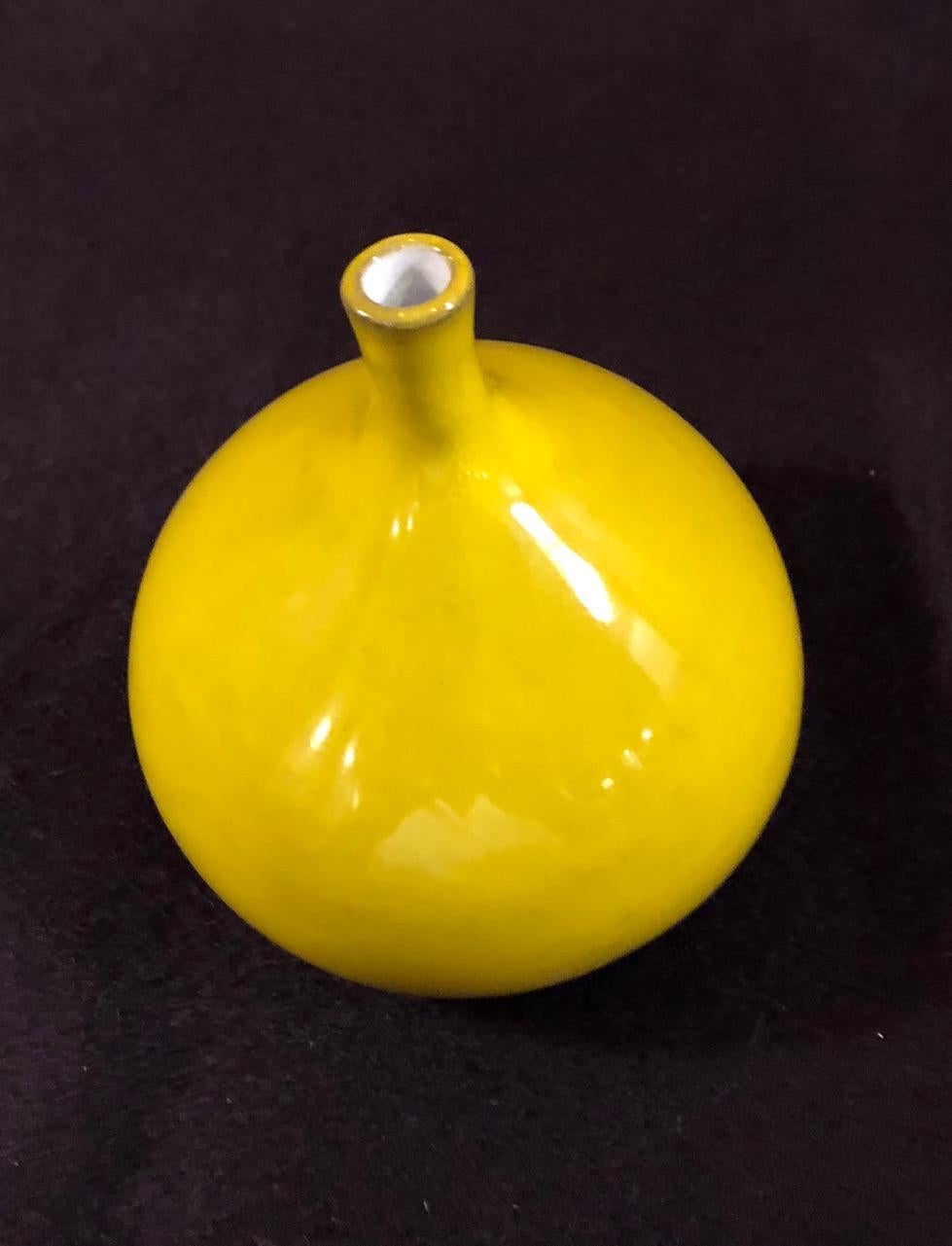A fig form vase by the French ceramic artists Jacques and Dani Ruelland (model n°2, small one). A yellow glaze. Signed.
 