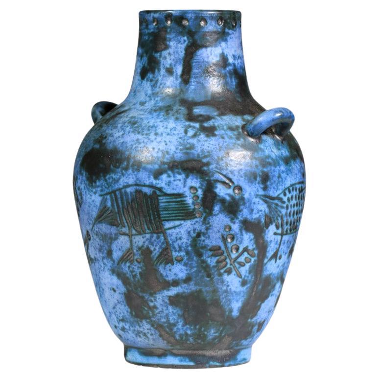Blue-glazed ceramic vase by French ceramist Jacques Blin from the 1960s. The entire vase is decorated with stylized birds. Very fine vintage condition, with slight traces of age and use (see photos). Artist's signature under the ceramic.