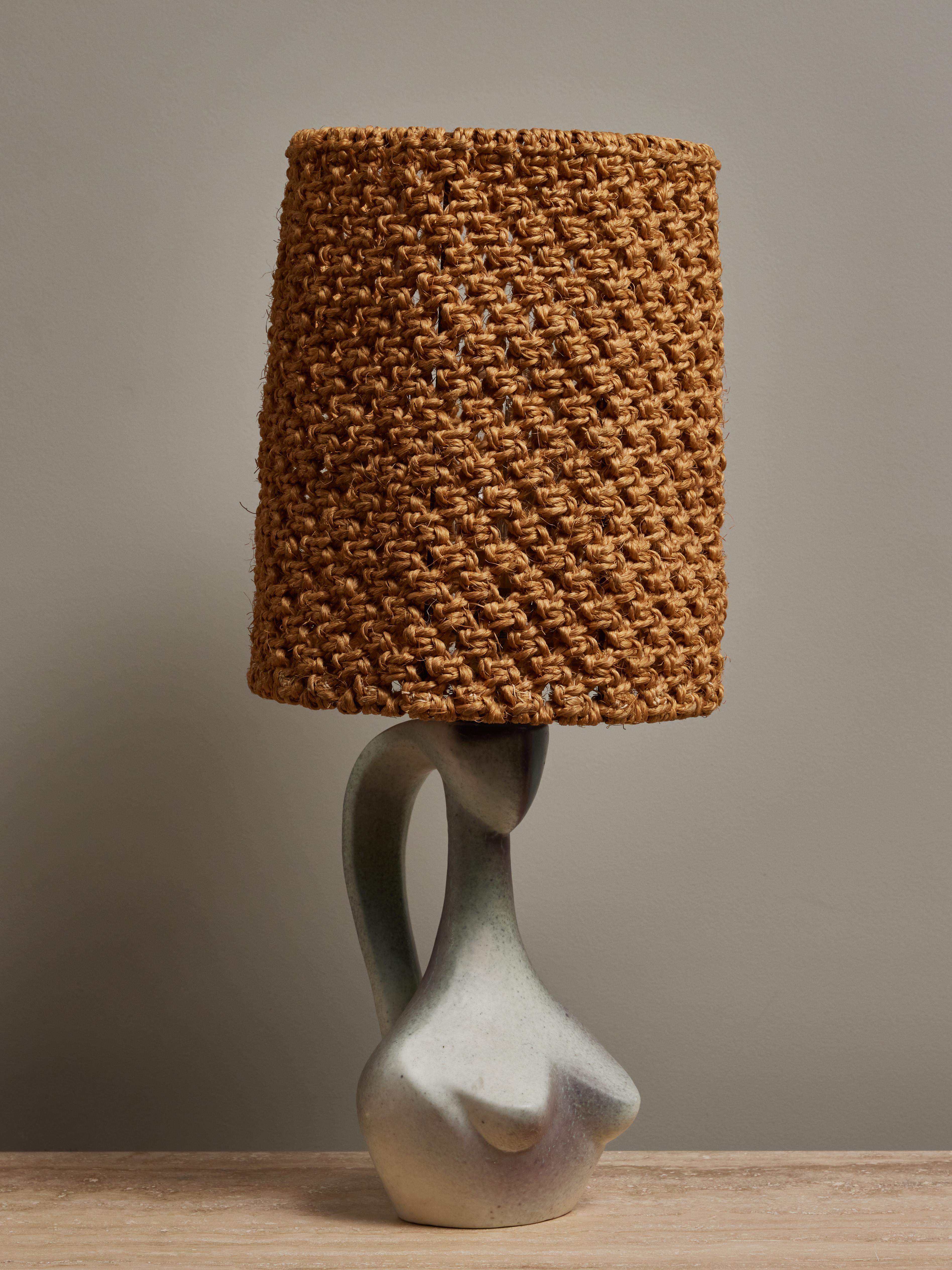 Beautiful ceramic table lamp signed by Jacques Blin, shaped like a woman bust, and topped with a woven rope shade.

Jacques Blin (1920-1995) Jacques Blin is a well-known French ceramist who started as an aeronautical and automobile engineer. During
