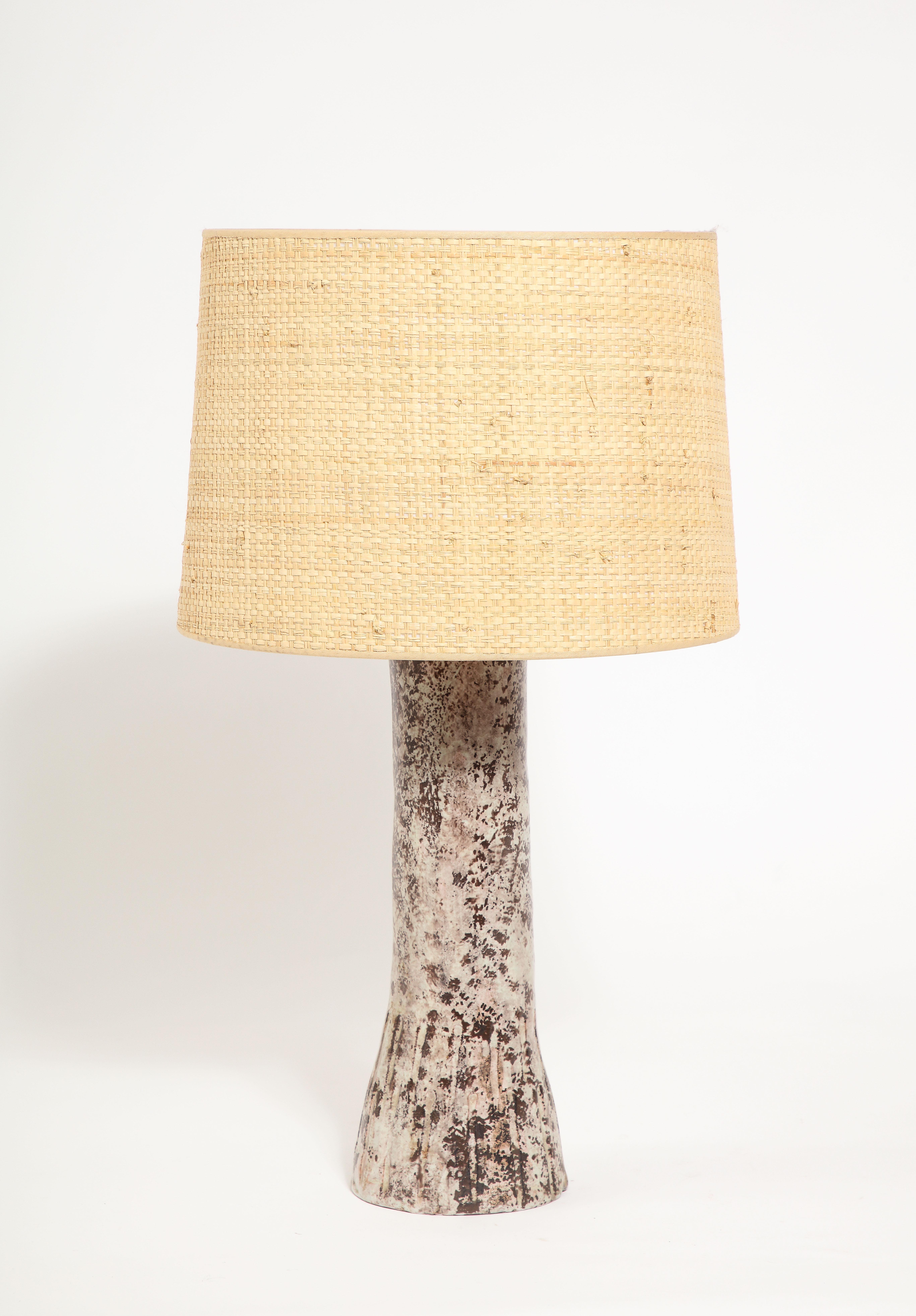 Lamp with an Incised and tapered base, earth tone glaze.
Base only 14x5