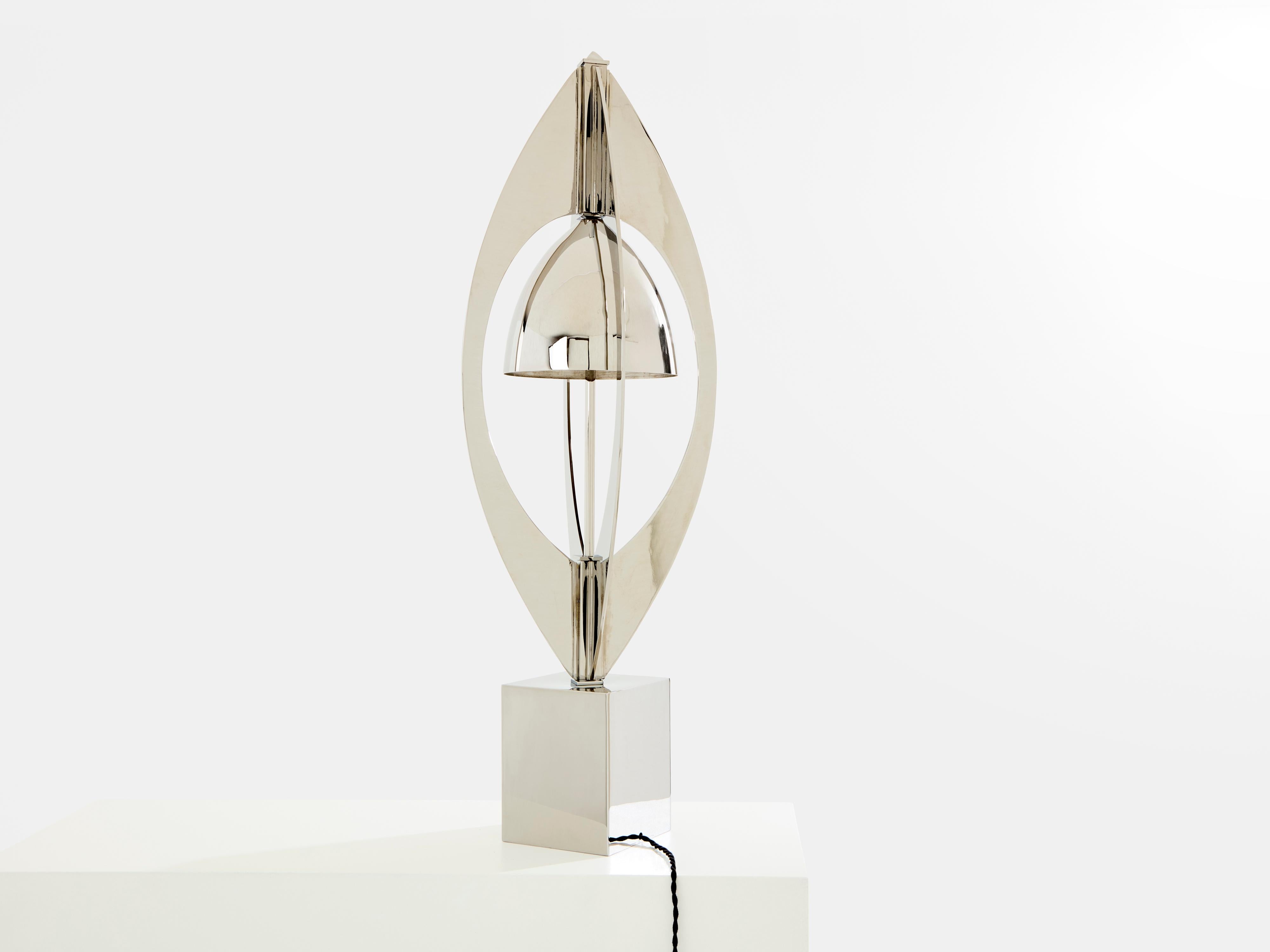 This beautiful nickel metal lamp, Ogive model, was designed by Jacques Charles for Maison Charles in 1965. This is arguably the most iconic Jacques Charles design, sculptural, and a true testimony of the Space Age era. The full structure is nickel
