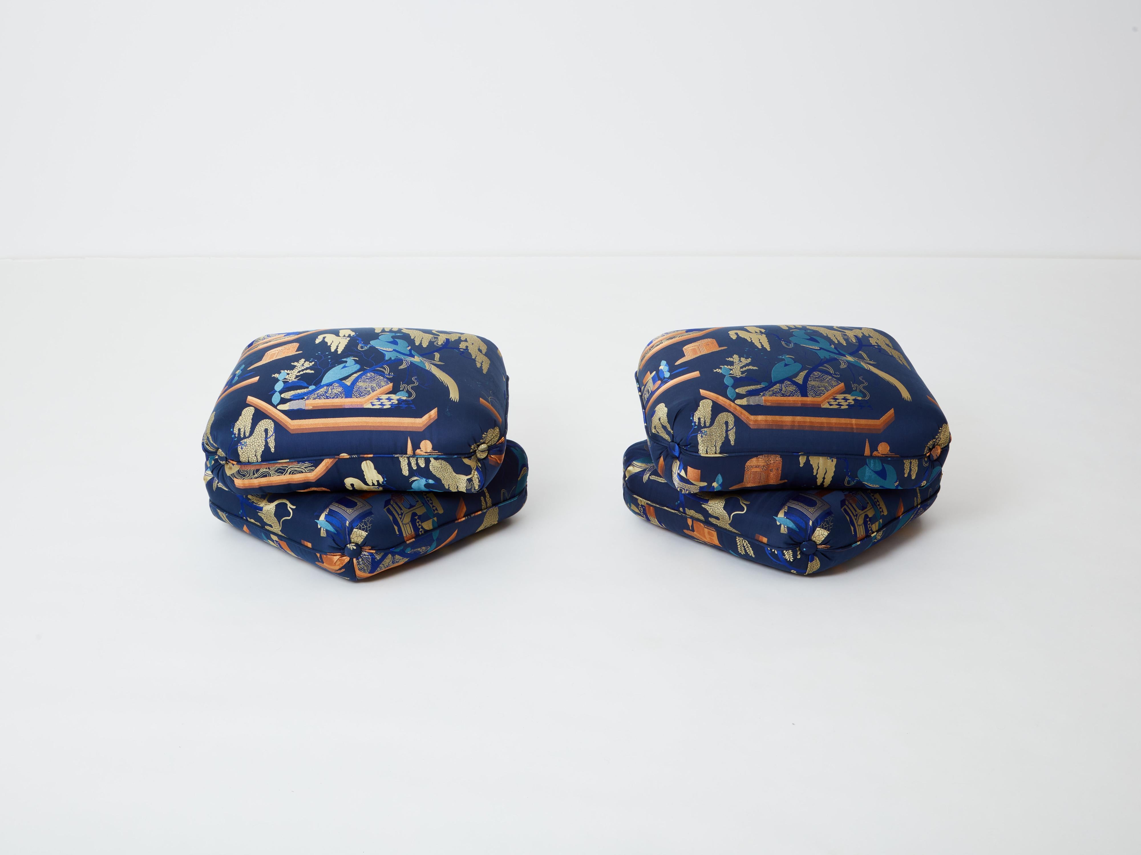 Beautiful pair of ottomans or stools by French Designer Jacques Charpentier for Maison Jansen designed in the 1970s. The stools ottomans are made of two large cushion elements connected together. They have been newly upholstered with a royal blue
