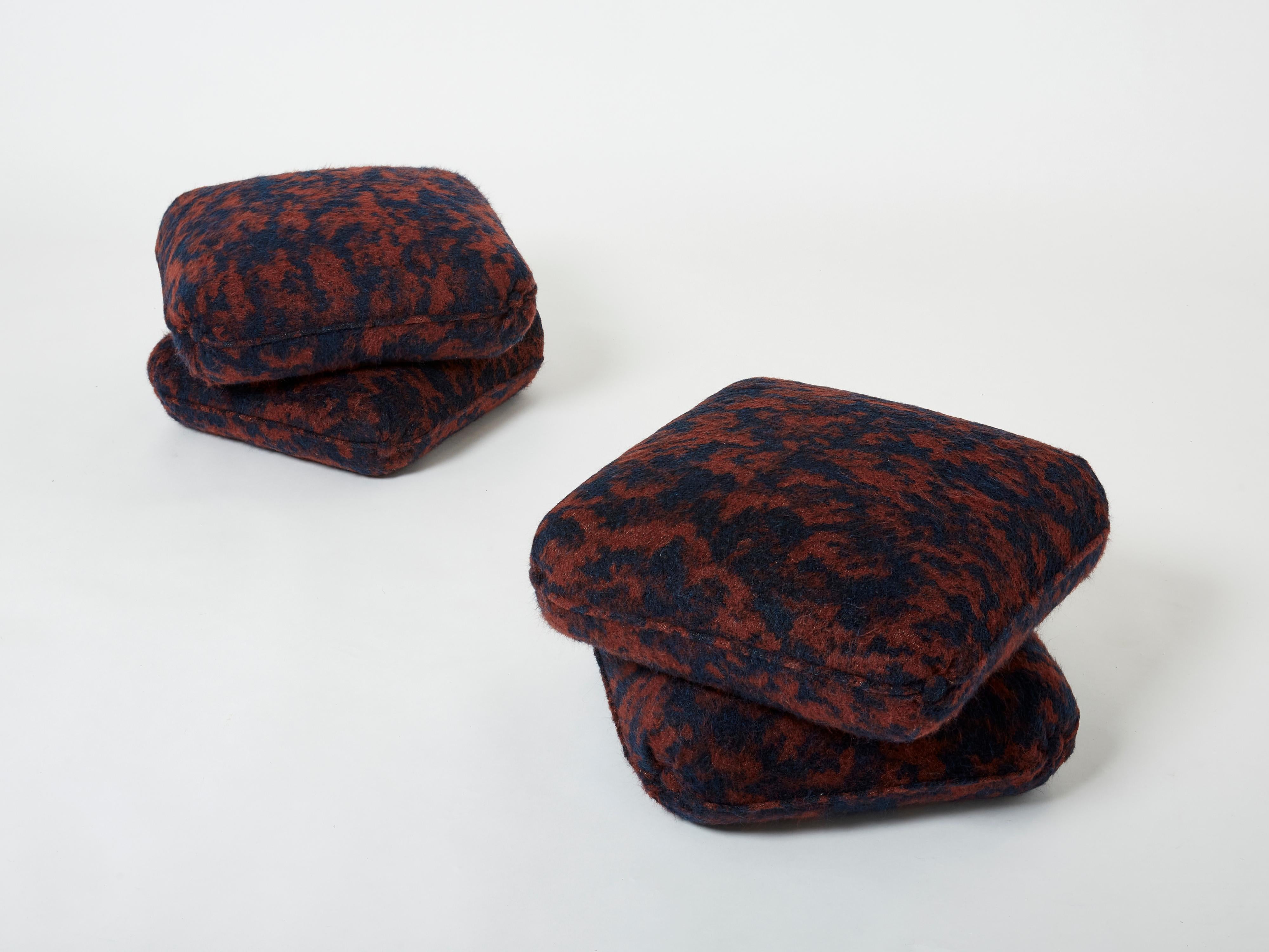 Beautiful pair of ottomans or stools by French Designer Jacques Charpentier for Maison Jansen designed in the 1970s. The stools poufs are made of two large cushion elements connected together. They have been newly upholstered with a plush wool