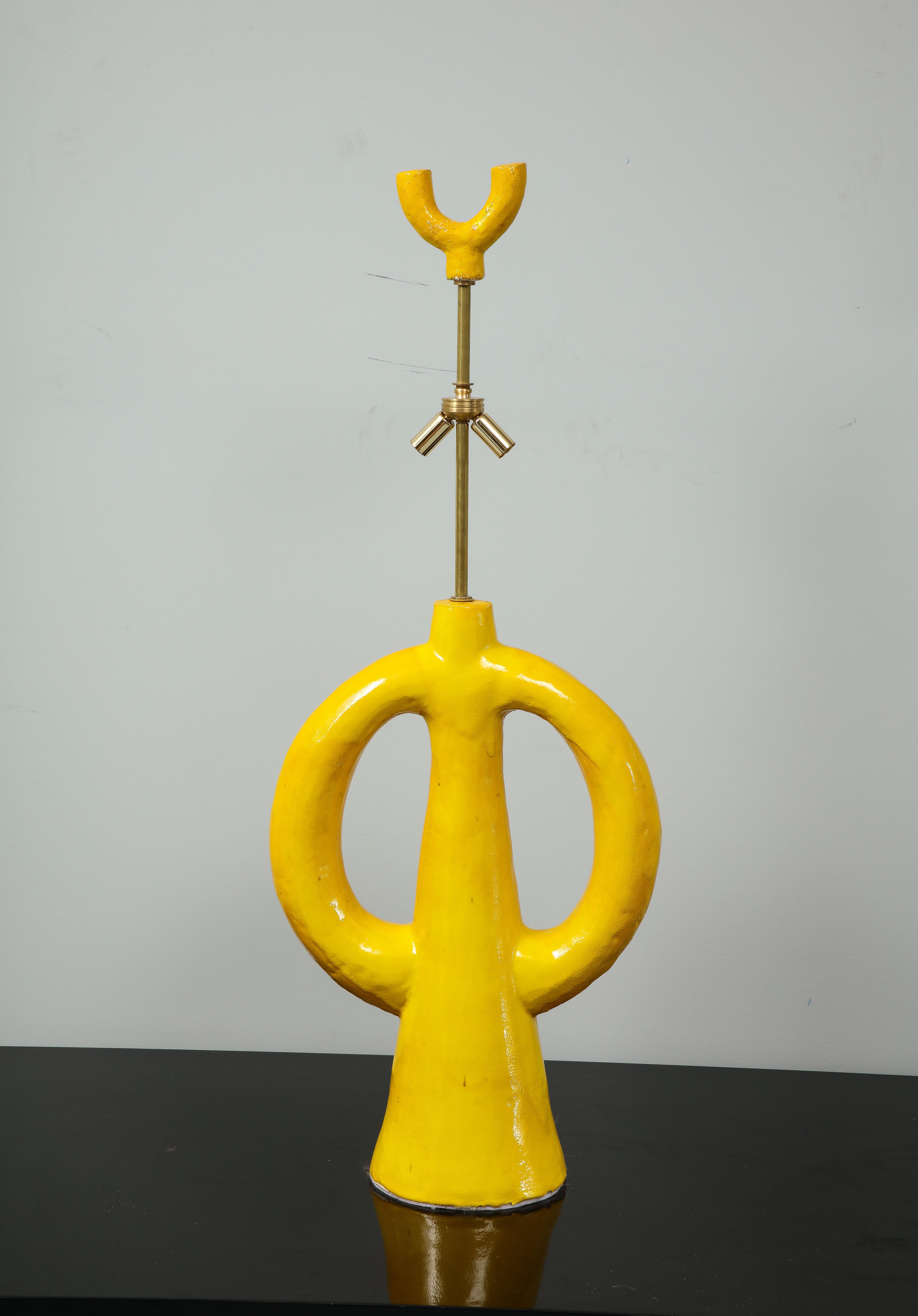 Jacques Darbaud who is a sculptor designed and made this pair of lamps. Their vivid yellow and their shape make them outstanding in a room. They are signed and American wired. 