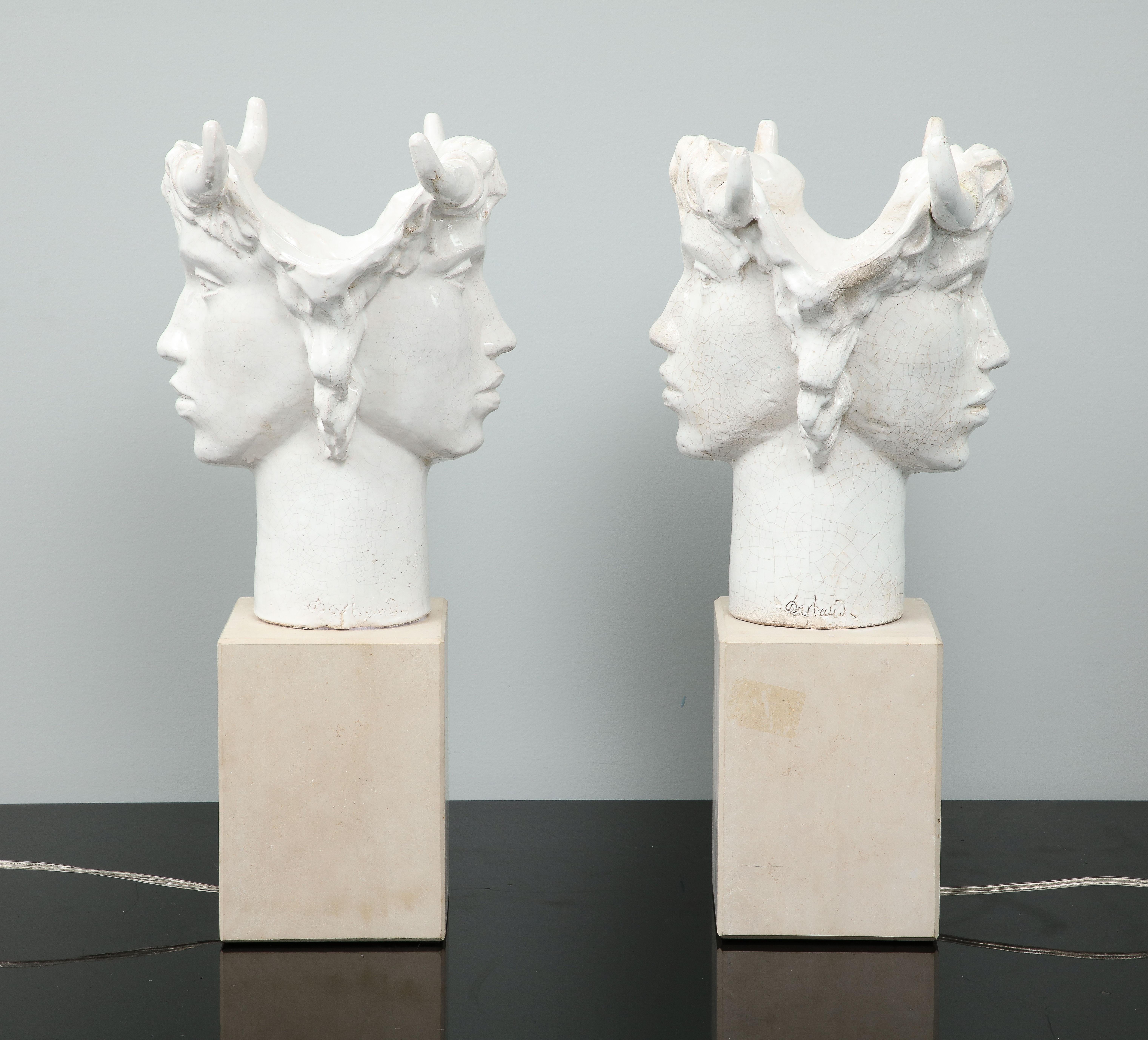 Jacques Darbaud was born in 1943 in Aix en Provence. This pair of lamps is one of his latest creation. He named it Janus in reference of the god of doors,   transitions and duality. With these 2 faces, these lamps represent the duality, the two
