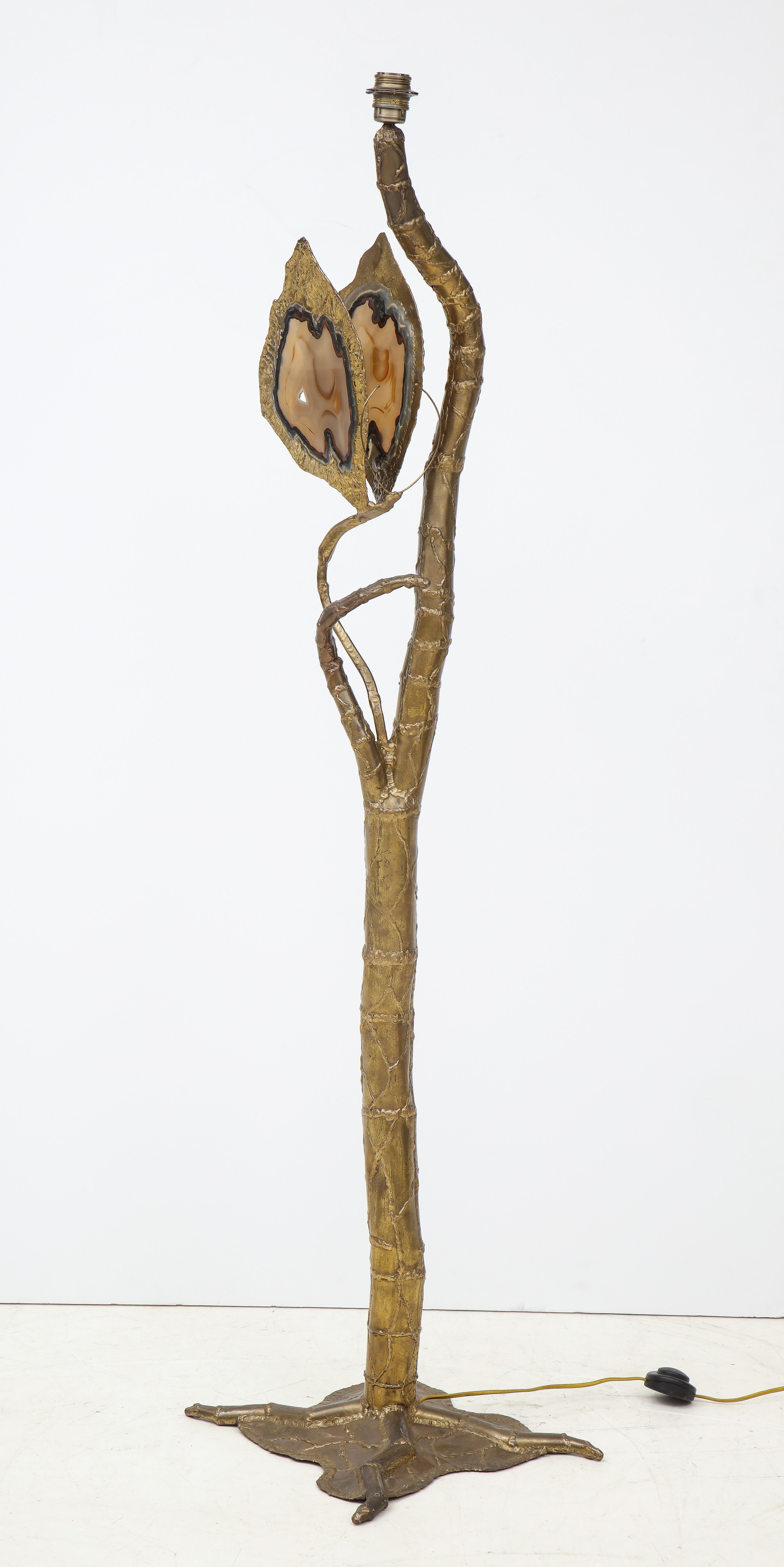 French modernist floor lamp composed of hand welded, gilt washed brass patchwork pieced trunk and limbs with a single butterfly with large agate geode wings,
circa 1970s, France.