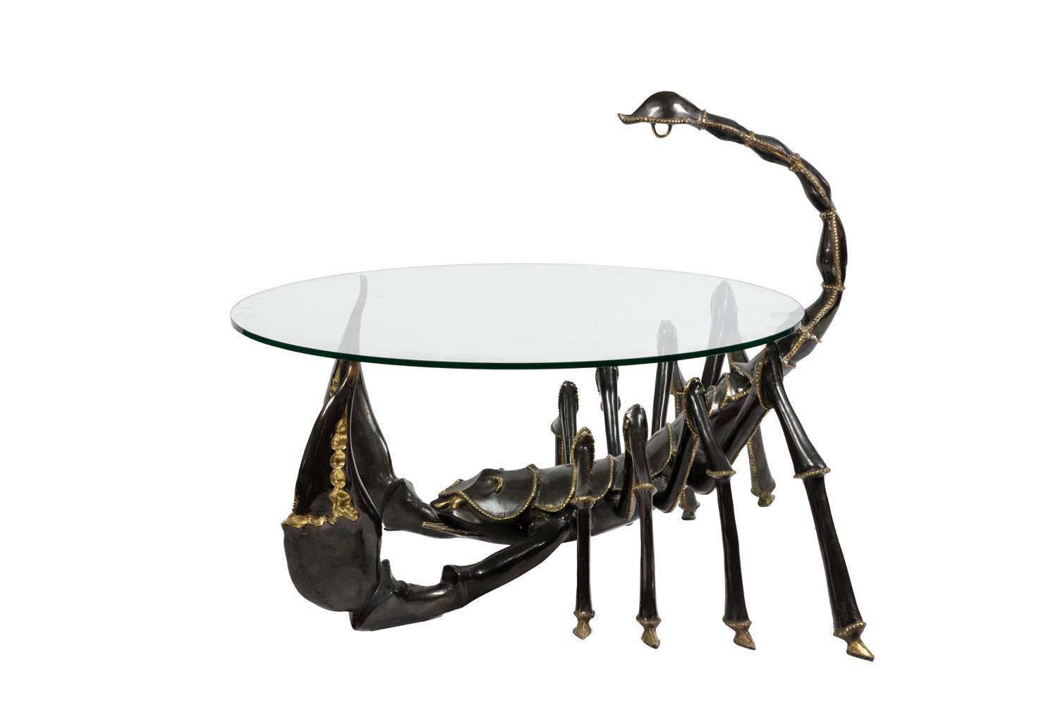Jacques Duval-Brasseur, signed.

Coffee table representing a scorpion, in bronze with two patinas. Round glass top.

French work realized in the 1970s.
