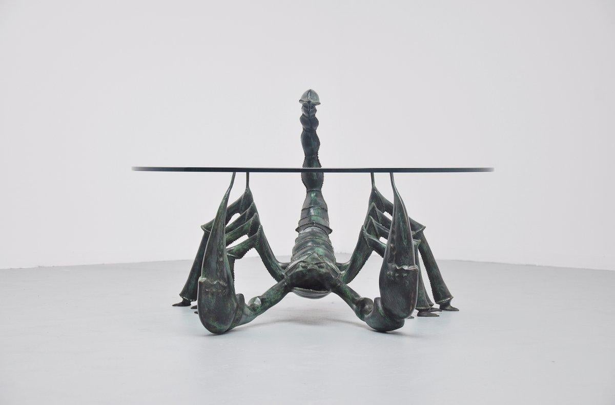 Very nice bronze crafted coffee table by Jacques Duval Brasseur, France, 1970. This table in the shape of a scorpion, was made of green patinated bronze, is extremely heavy and has a thick hardened glass top. Super decorative table, a bit scary