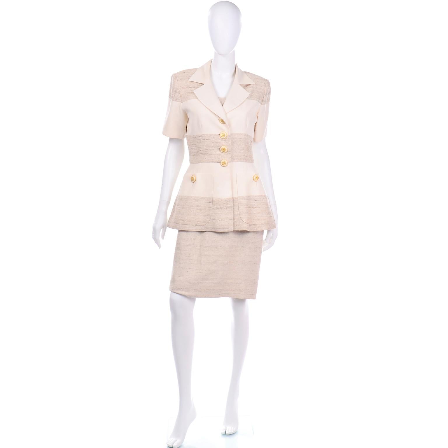 This is a beautifully made vintage Jacques Fath natural linen stripe short sleeve jacket with a sheath dress The sleeveless dress has a square neck and the waist is accentuated with darts, creating a flattering  silhouette. There is a back center