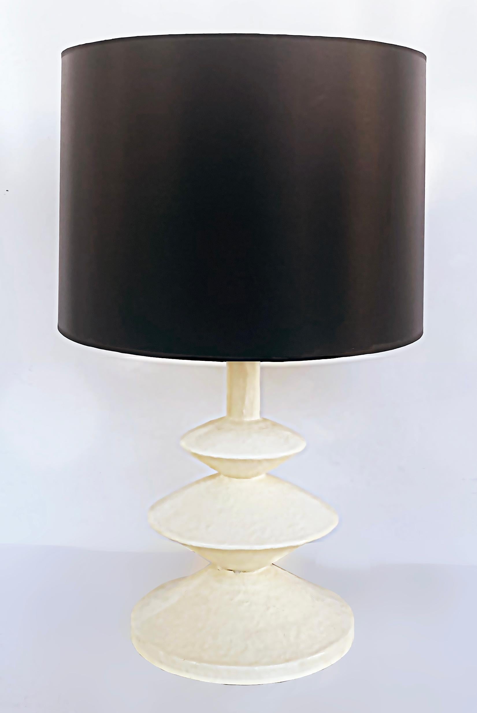 Jacques Grange Plaster Table Lamps Sirmos Attributed, Giacometti Manner

It is a fabulous early and highly sought-after pair of table lamps created by Jacques Grange after a design by Giacometti and attributed to the American manufacturer Sirmos.